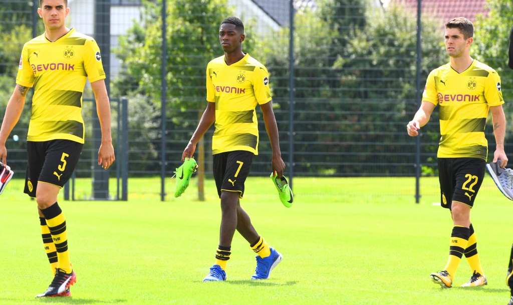 Ousmane Dembele and Christian Pulisic became budding superstars under Tuchel's tutelage. (Photo by Patrik Stollarz/AFP/Getty Images)