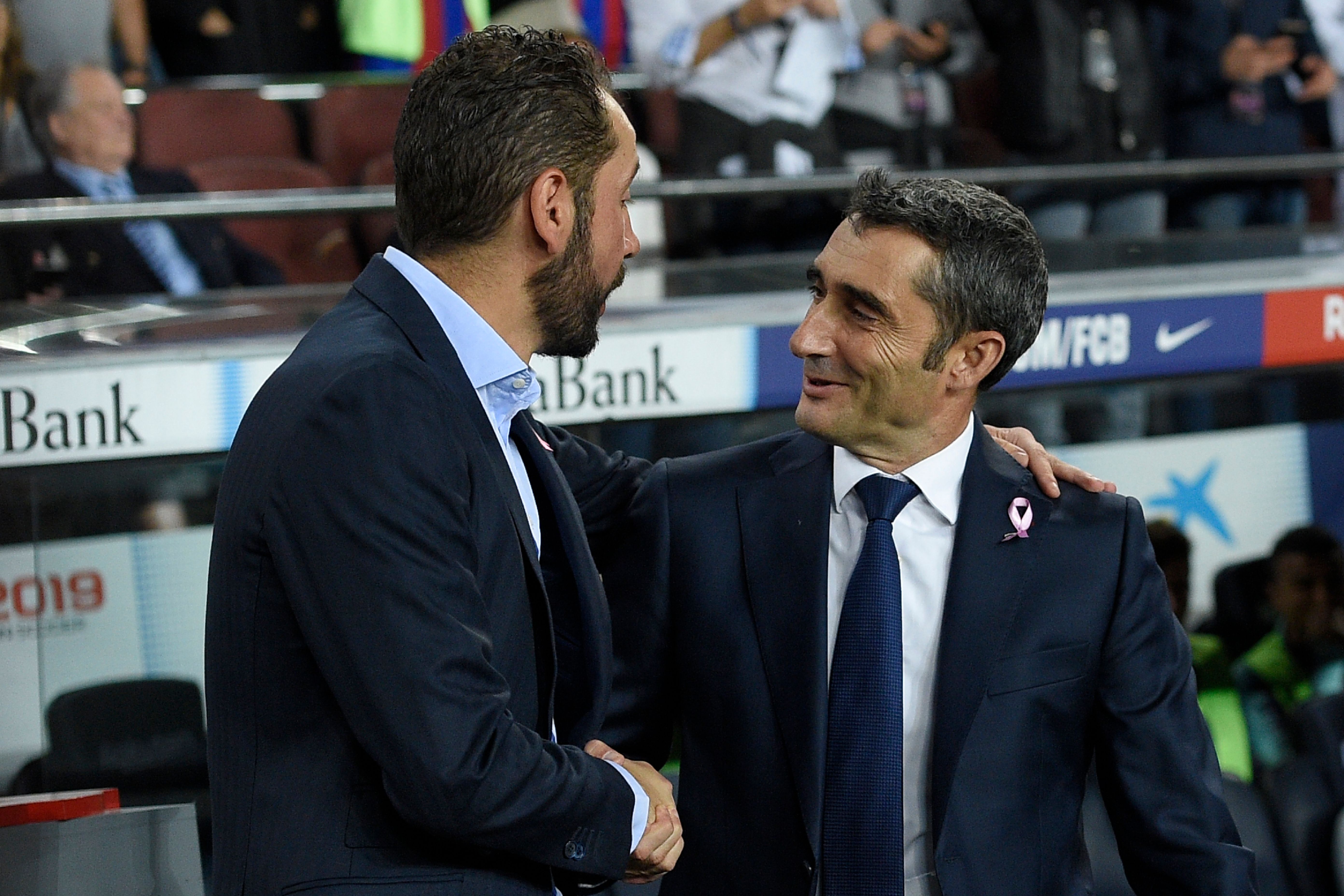 Barcelona's Spanish coach Ernesto Valverde (R) shakes hands with Sevilla's Spanish coach Pablo Machin during the Spanish league football match FC Barcelona against Sevilla FC at the Camp Nou stadium in Barcelona on October 20, 2018. (Photo by LLUIS GENE / AFP) (Photo credit should read LLUIS GENE/AFP/Getty Images)