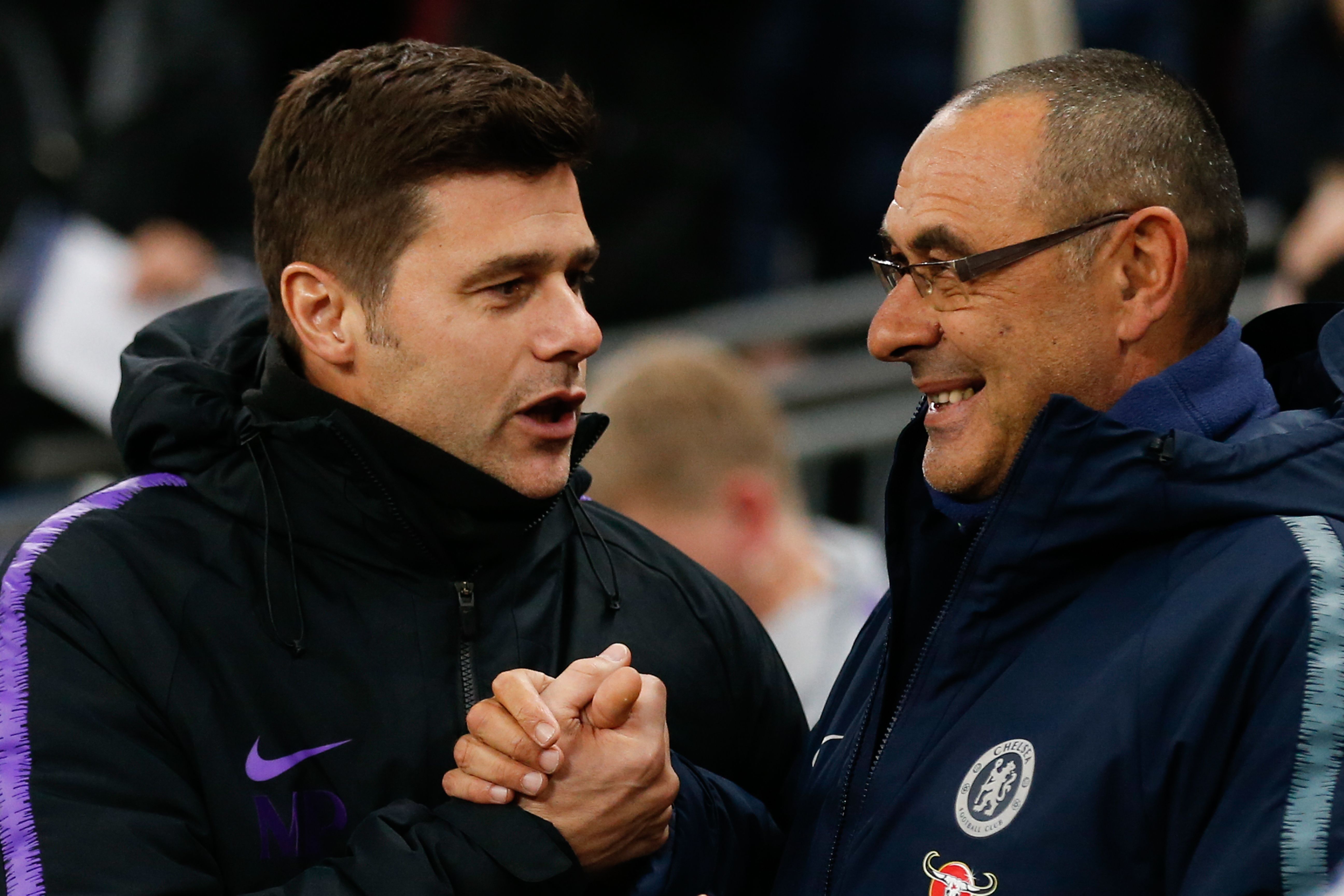Chelsea's Italian head coach Maurizio Sarri (R) greets Tottenham Hotspur's Argentinian head coach Mauricio Pochettino (L) before the English Premier League football match between Tottenham Hotspur and Chelsea at Wembley Stadium in London, on November 24, 2018. (Photo by Ian KINGTON / IKIMAGES / AFP) / RESTRICTED TO EDITORIAL USE. No use with unauthorized audio, video, data, fixture lists, club/league logos or 'live' services. Online in-match use limited to 45 images, no video emulation. No use in betting, games or single club/league/player publications. (Photo credit should read IAN KINGTON/AFP/Getty Images)