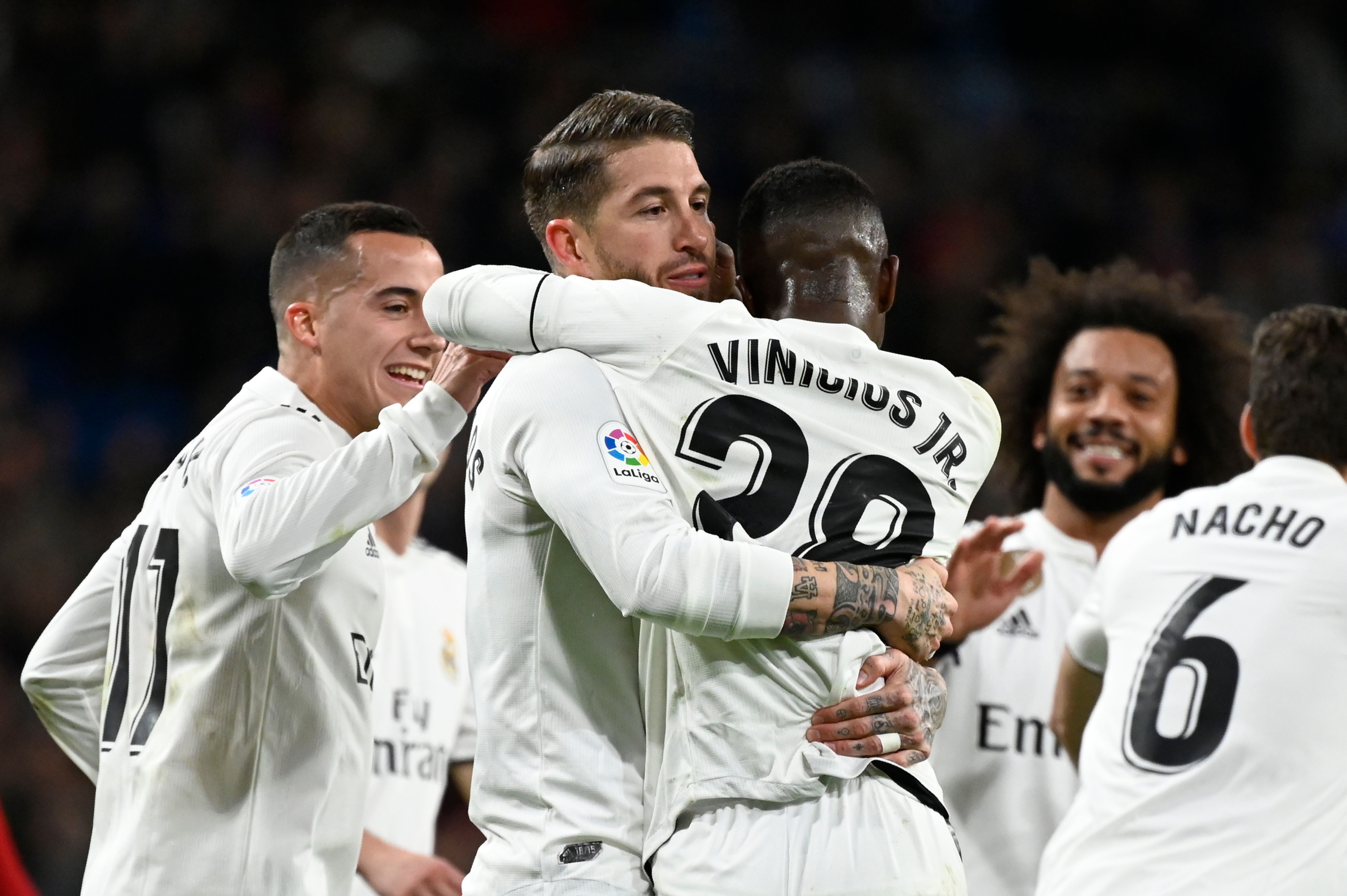 Real Madrid's Spanish defender Sergio Ramos (C) celebrates with teammates after scoring a penalty during the Spanish Copa del Rey (King's Cup) quarter-final first leg football match between Real Madrid CF and Girona FC at the Santiago Bernabeu stadium in Madrid on January 24, 2019. (Photo by JAVIER SORIANO / AFP) (Photo credit should read JAVIER SORIANO/AFP/Getty Images)