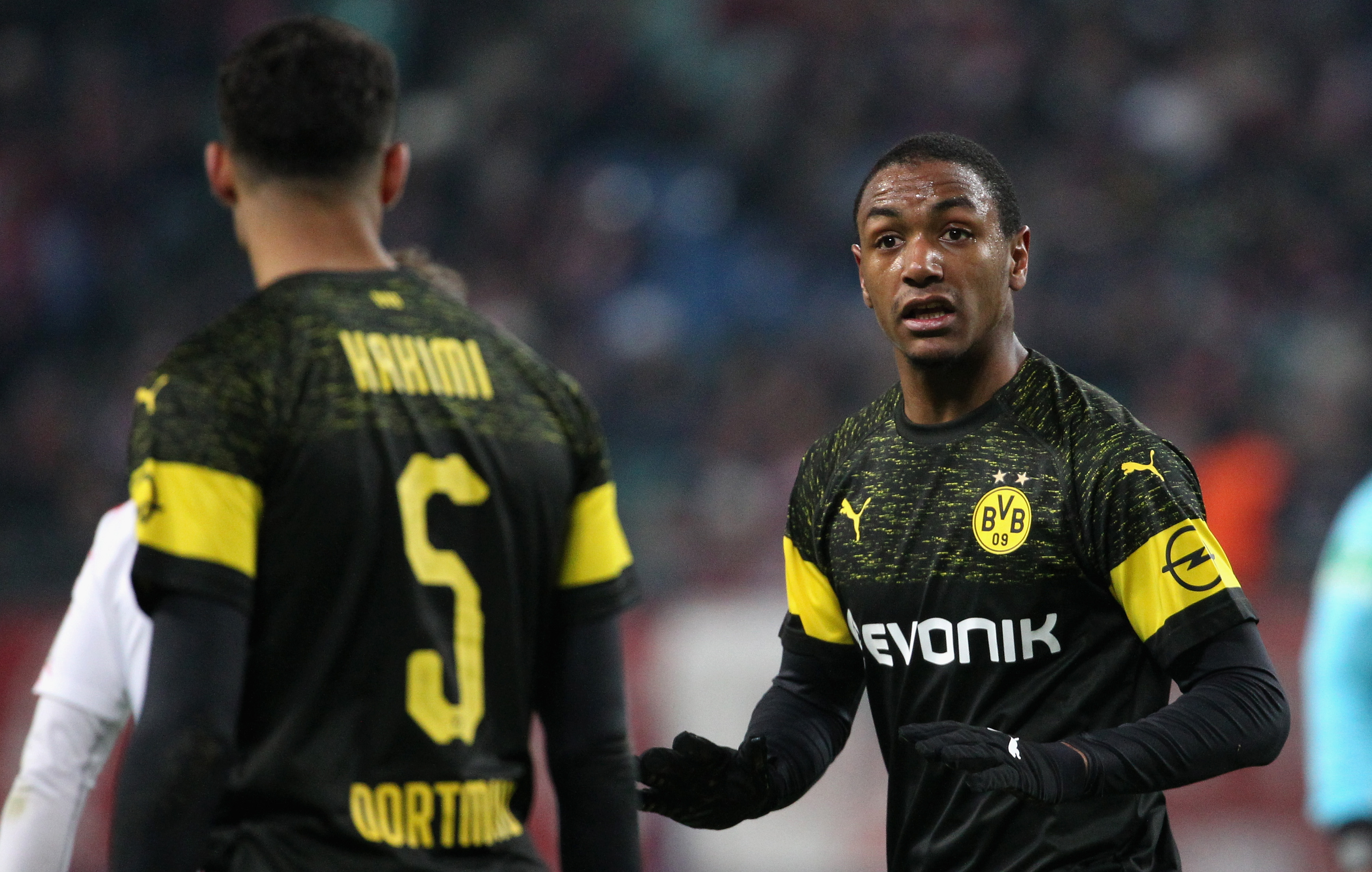 LEIPZIG, GERMANY - JANUARY 19:  Abdou Diallo talks to Achraf Hakimi of Dortmund during the Bundesliga match between RB Leipzig and Borussia Dortmund at Red Bull Arena on January 19, 2019 in Leipzig, Germany. (Photo by Karina Hessland-Wissel/Bongarts/Getty Images)