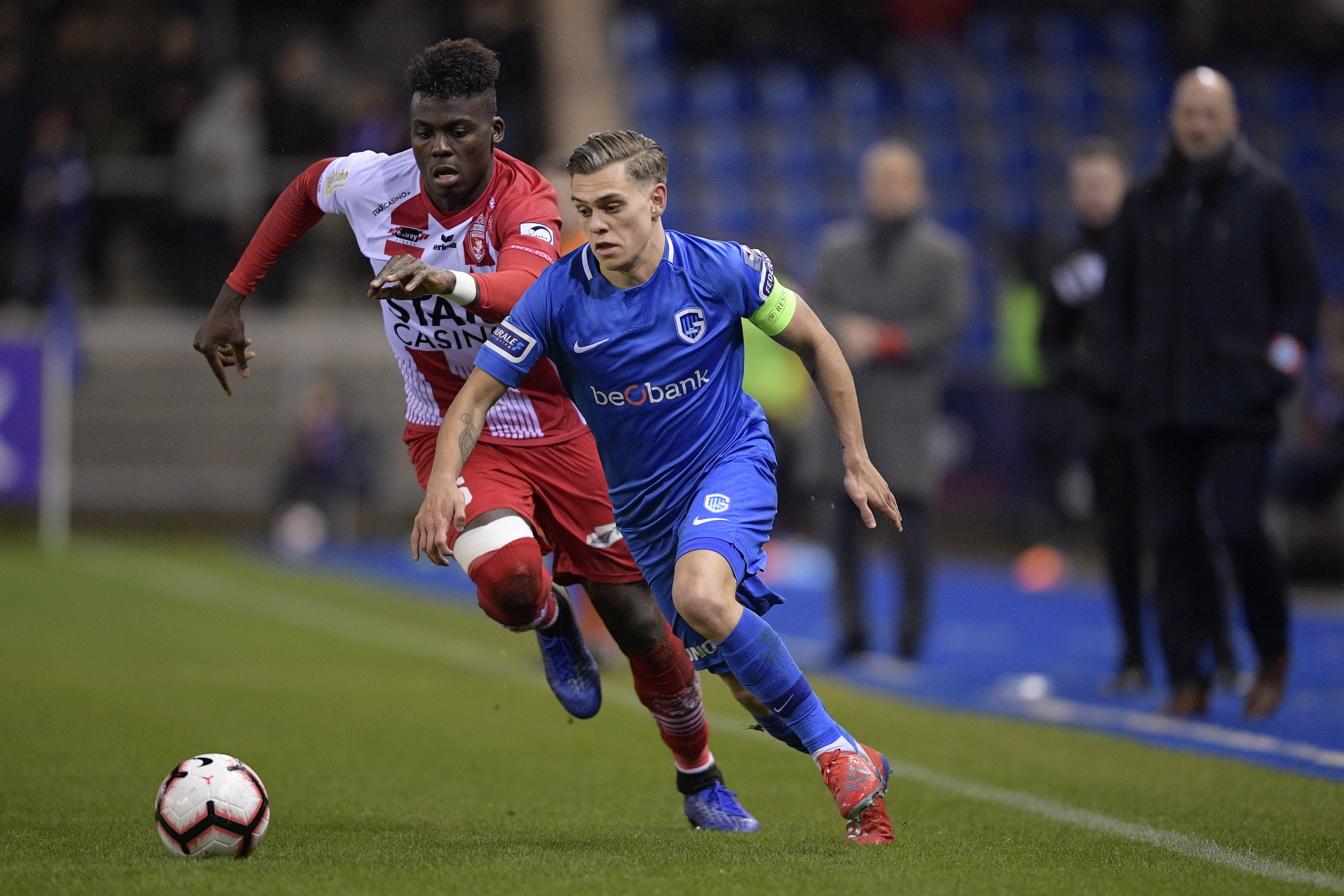Mouscron's Franck Boya and Genk's Leandro Trossard fight for the ball during a soccer match between KRC Genk and Royal Excel Mouscron, Saturday 26 January 2019 in Genk, on the 23rd day of the 'Jupiler Pro League' Belgian soccer championship season 2018-2019. BELGA PHOTO YORICK JANSENS (Photo credit should read YORICK JANSENS/AFP/Getty Images)