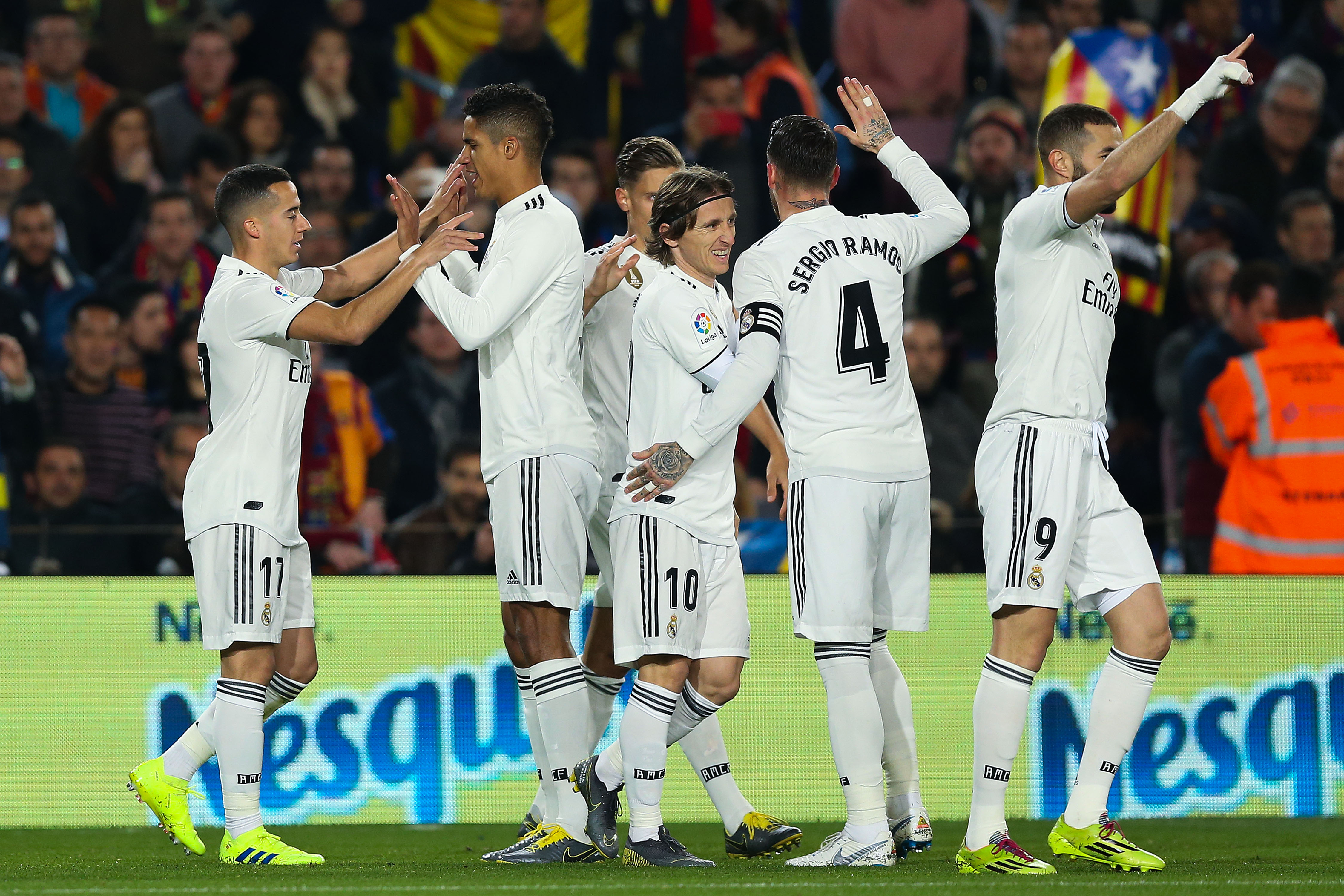 BARCELONA, SPAIN - FEBRUARY 06: Lucas Vazquez of Real Madrid CF celebrates with his team mates after scoring his team's first goal during the Copa del Semi Final first leg match between Barcelona and Real Madrid at Nou Camp on February 06, 2019 in Barcelona, Spain. (Photo by Angel Martinez/Getty Images)