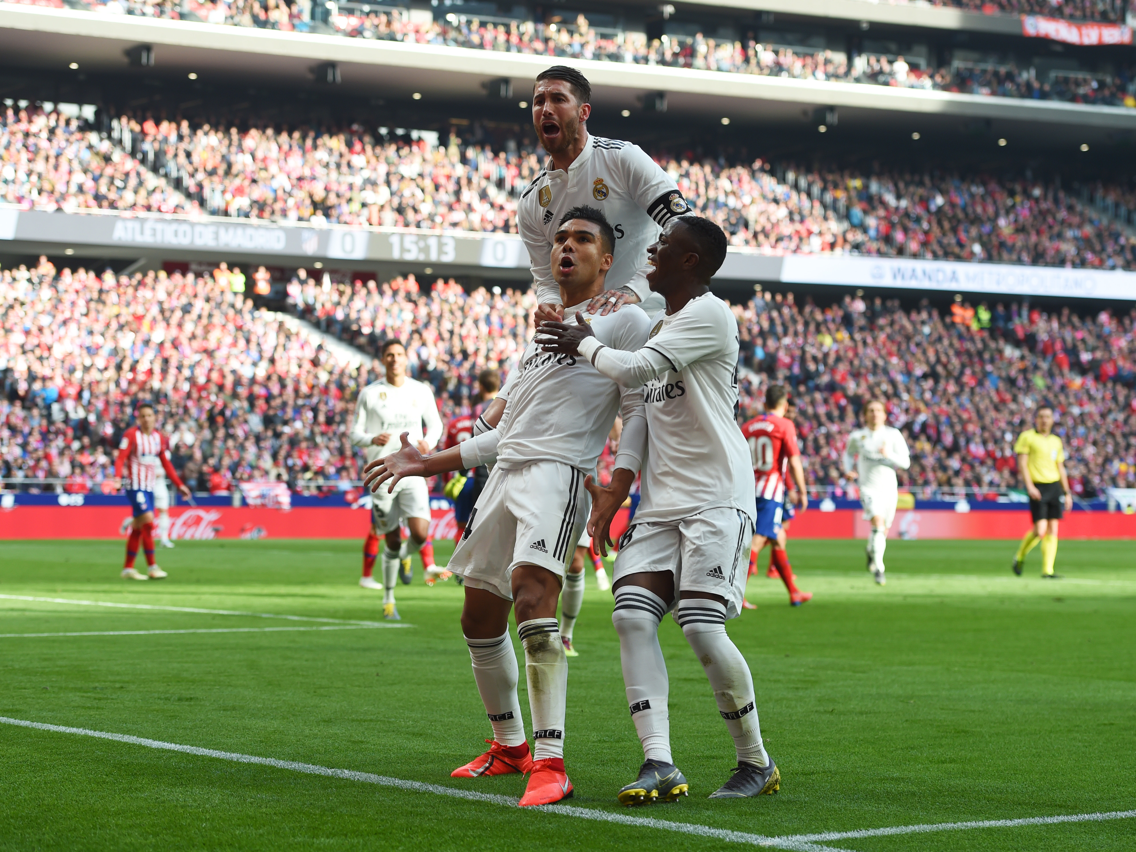 MADRID, SPAIN - FEBRUARY 09: Casemiro of Real Madrid (14) celebrates after scoring his team's first goal with Sergio Ramos and Vinicius Junior during the La Liga match between Club Atletico de Madrid and Real Madrid CF at Wanda Metropolitano on February 09, 2019 in Madrid, Spain. (Photo by Denis Doyle/Getty Images)