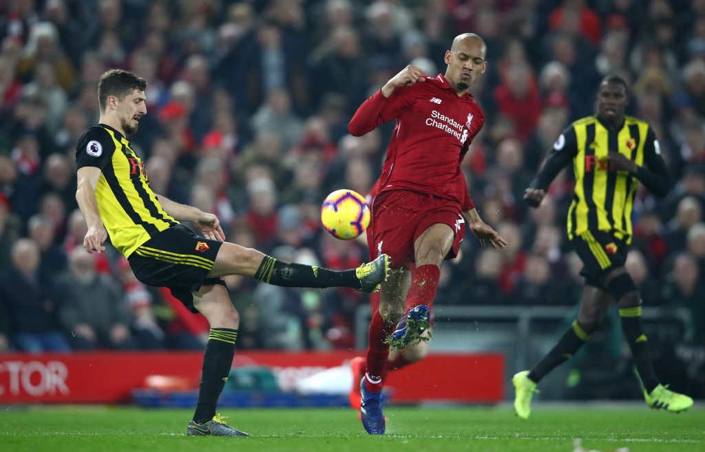 LIVERPOOL, ENGLAND - FEBRUARY 27: Craig Cathcart of Watford battles for possession with Fabinho of Liverpool during the Premier League match between Liverpool FC and Watford FC at Anfield on February 27, 2019 in Liverpool, United Kingdom. (Photo by Clive Brunskill/Getty Images)