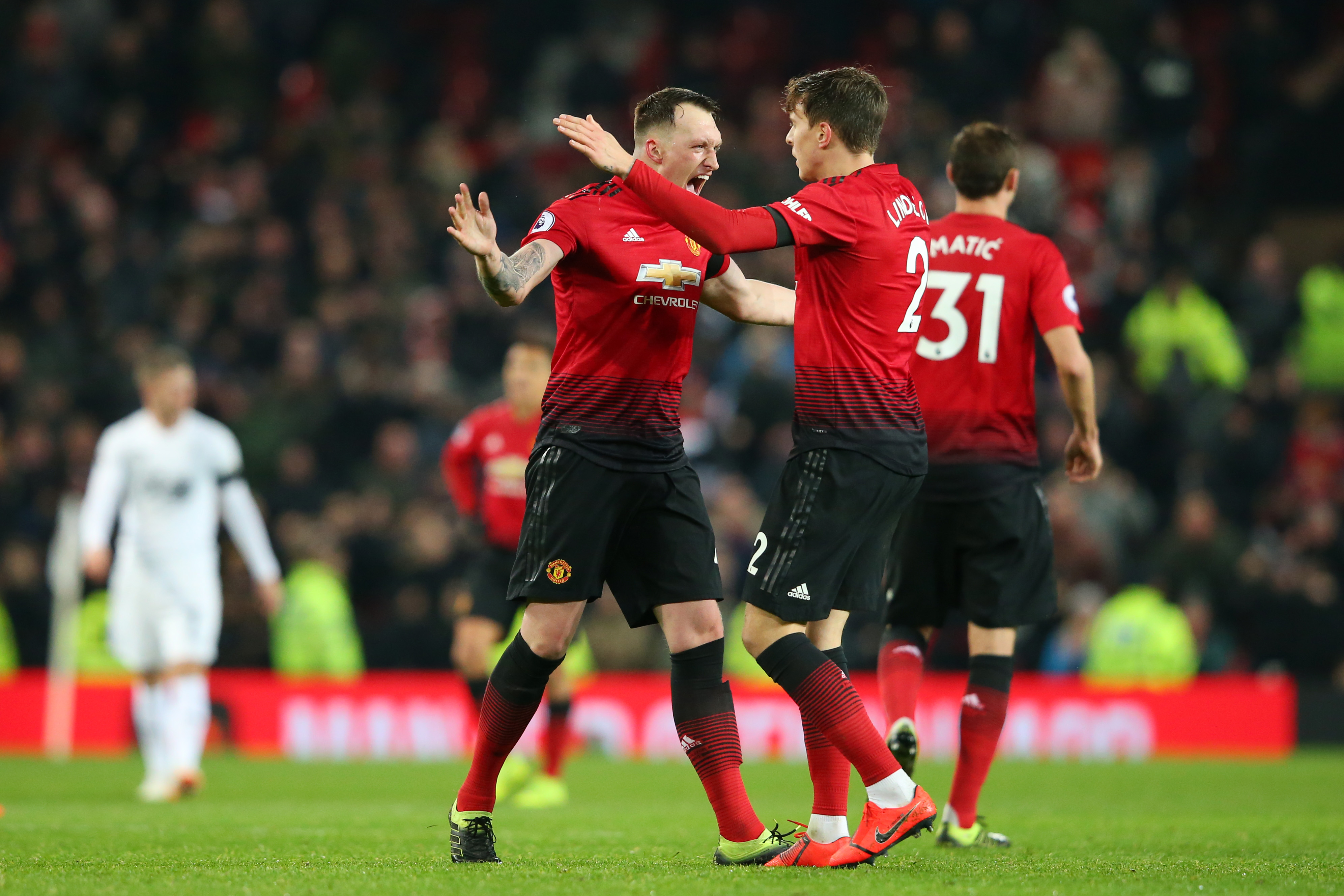 MANCHESTER, ENGLAND - JANUARY 29: Victor Lindelof of Manchester United celebrates after scoring his team's second goal with Phil Jones of Manchester United during the Premier League match between Manchester United and Burnley at Old Trafford on January 29, 2019 in Manchester, United Kingdom. (Photo by Alex Livesey/Getty Images)