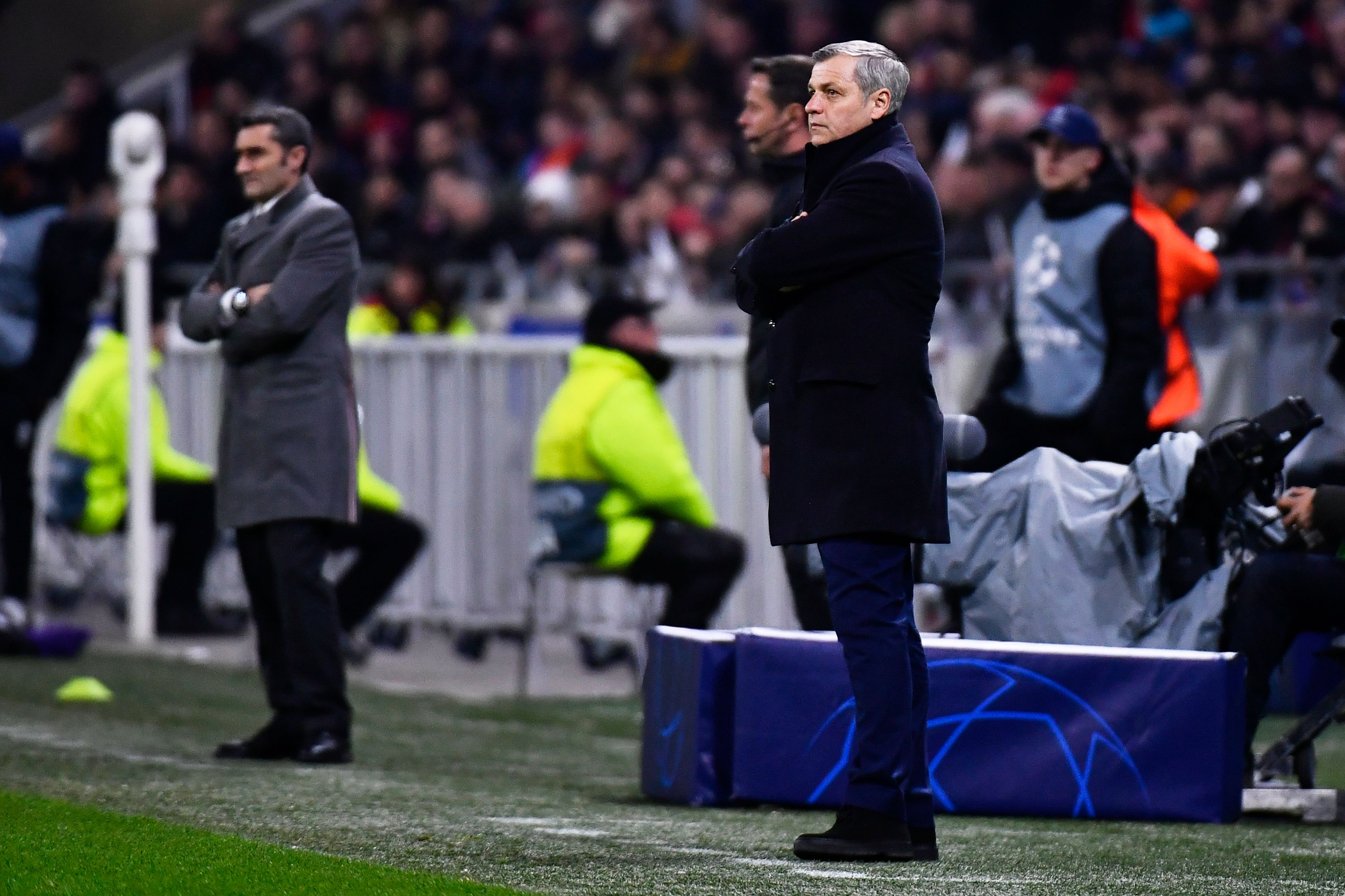Lyon's French coach Bruno Genesio (R) stands next to Barcelona's Spanish coach Ernesto Valverde (L) during the UEFA Champions League round of 16 first leg football match between Lyon (OL) and FC Barcelona on February 19, 2019, at the Groupama Stadium in Decines-Charpieu, central-eastern France. (Photo by JEFF PACHOUD / AFP) (Photo credit should read JEFF PACHOUD/AFP/Getty Images)