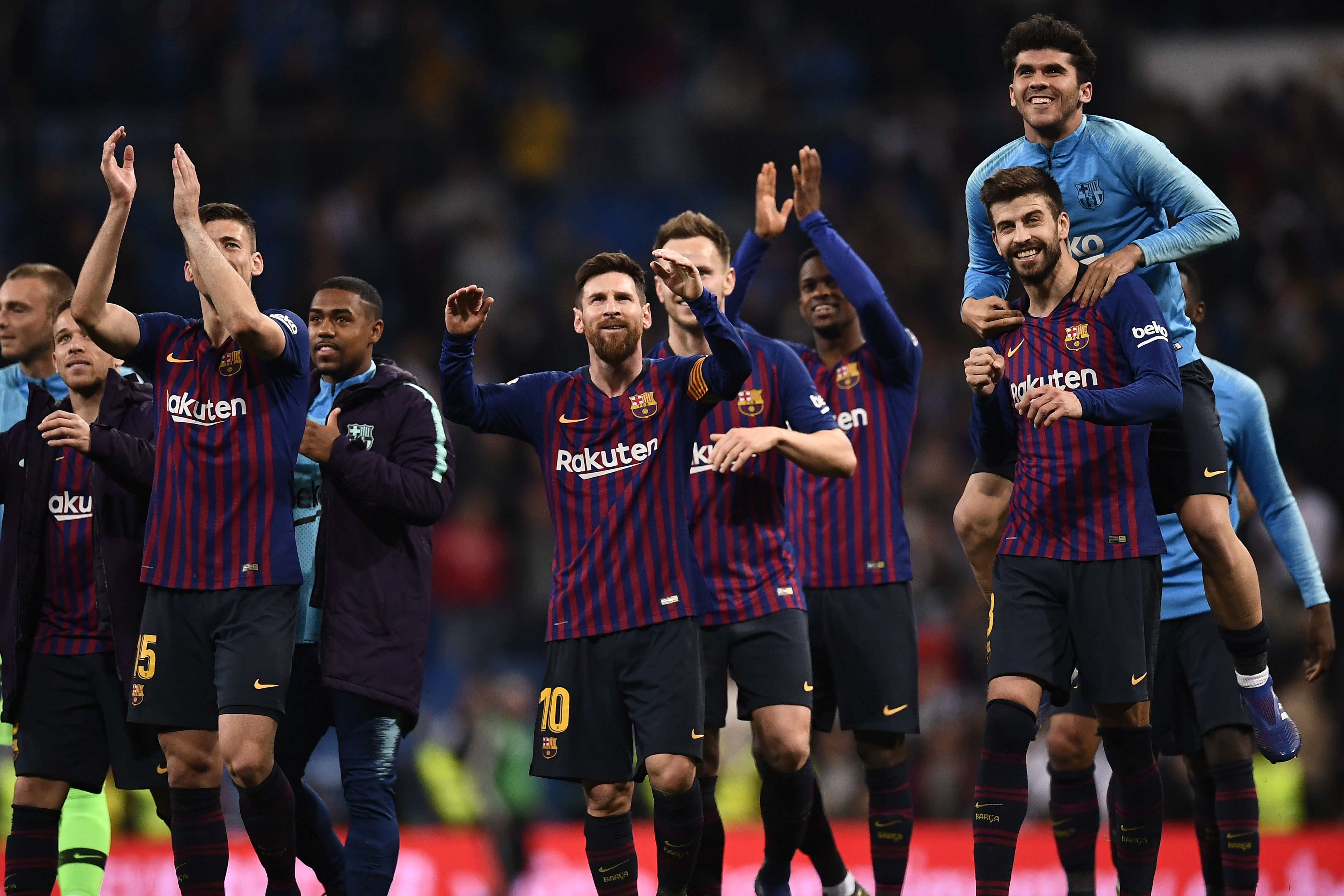 Barcelona players celebrate their win at the end of the Spanish league football match between Real Madrid CF and FC Barcelona at the Santiago Bernabeu stadium in Madrid on March 2, 2019. (Photo by OSCAR DEL POZO / AFP) (Photo credit should read OSCAR DEL POZO/AFP/Getty Images)