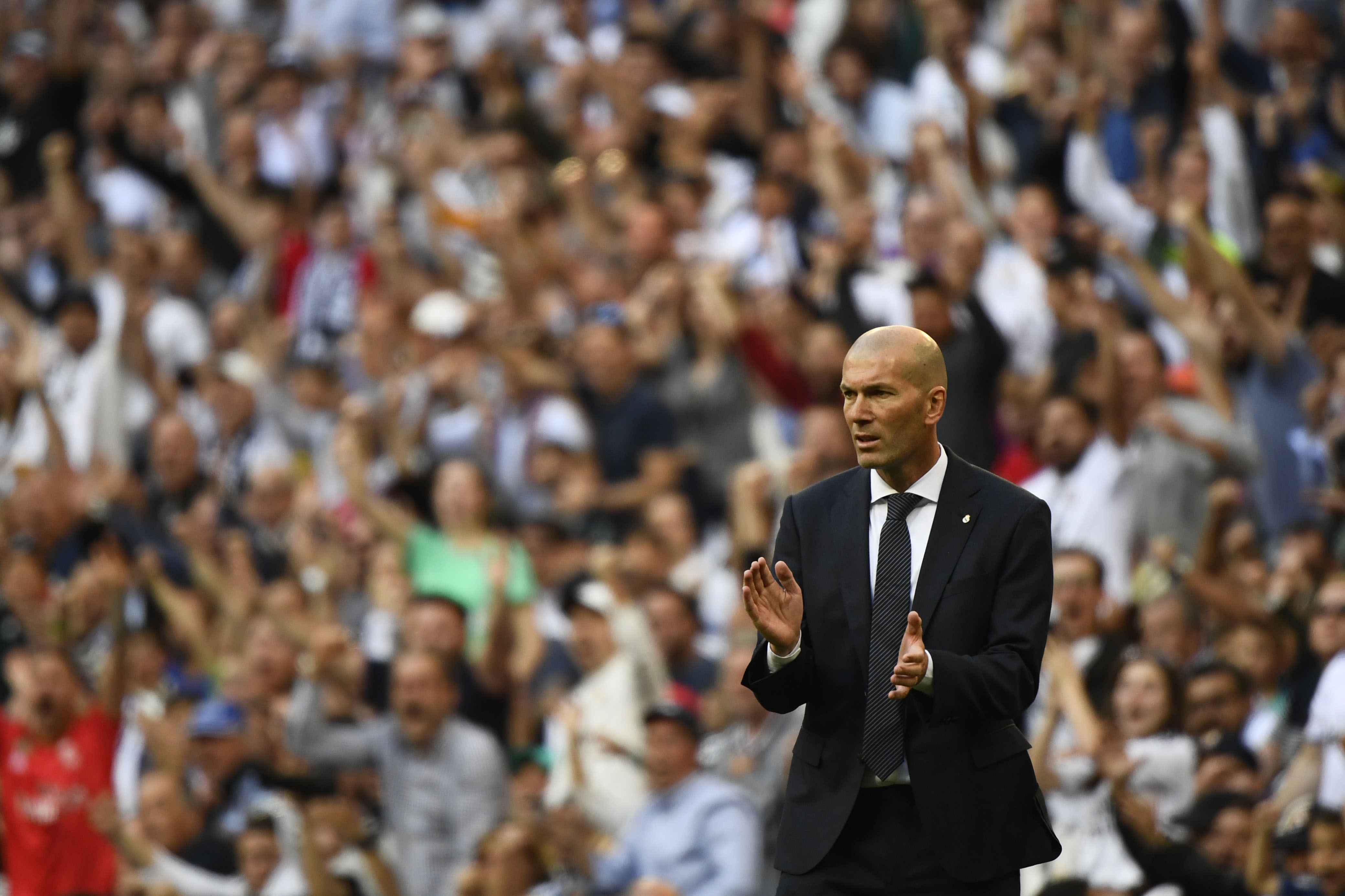Real Madrid's French coach Zinedine Zidane celebrates their opening goal during the Spanish league football match between Real Madrid CF and RC Celta de Vigo at the Santiago Bernabeu stadium in Madrid on March 16, 2019. (Photo by GABRIEL BOUYS / AFP) (Photo credit should read GABRIEL BOUYS/AFP/Getty Images)
