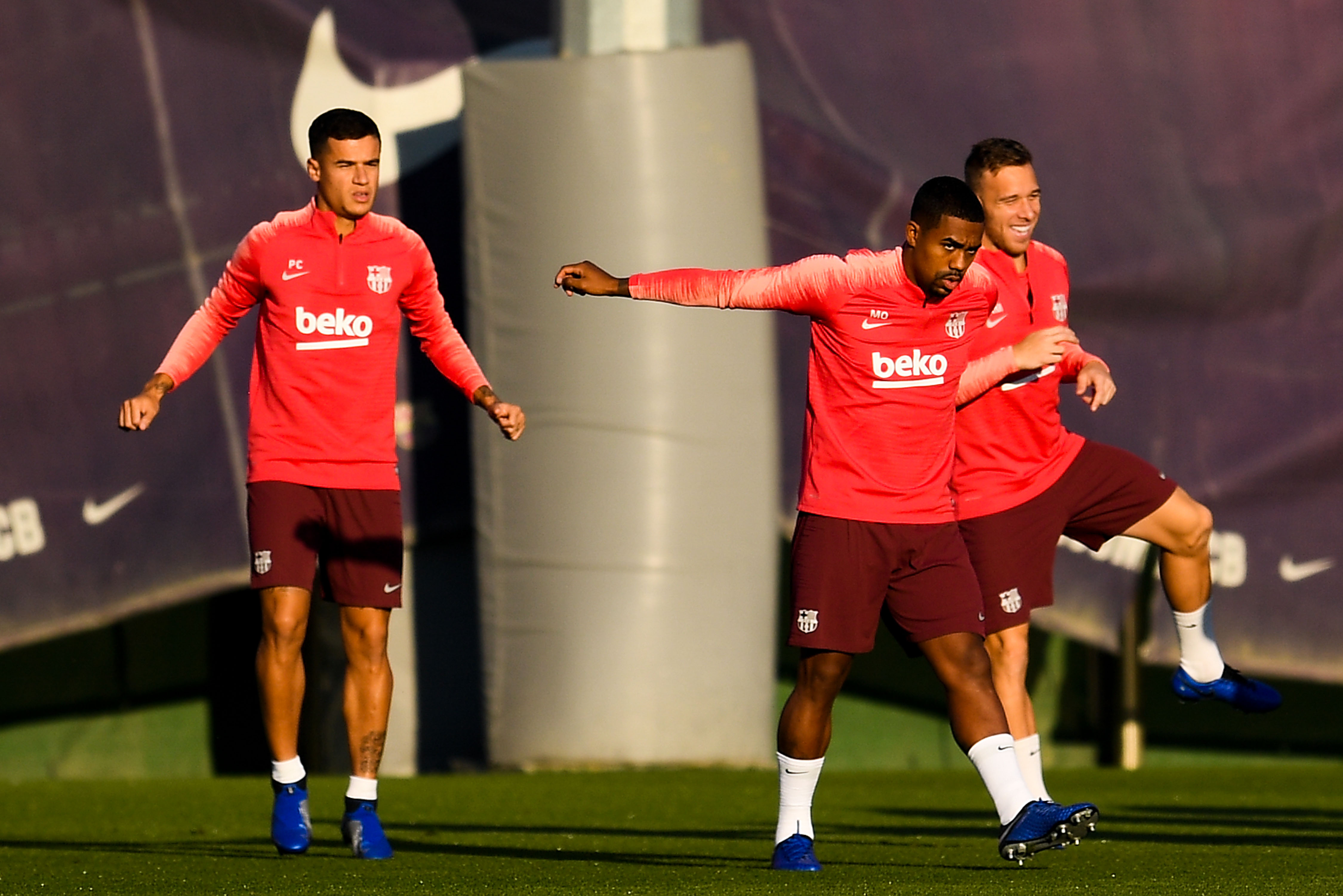 SANT JOAN DESPI, SPAIN - OCTOBER 23: (L-R) Philippe Coutinho, Malcom and Arthur of FC Barcelona warm up during a training session ahead of the UEFA Champions League Group B match between FC Barcelona and FC Internazionale at Ciutat Esportiva Joan Gamper on October 23, 2018 in Sant Joan Despi, Spain. (Photo by David Ramos/Getty Images)