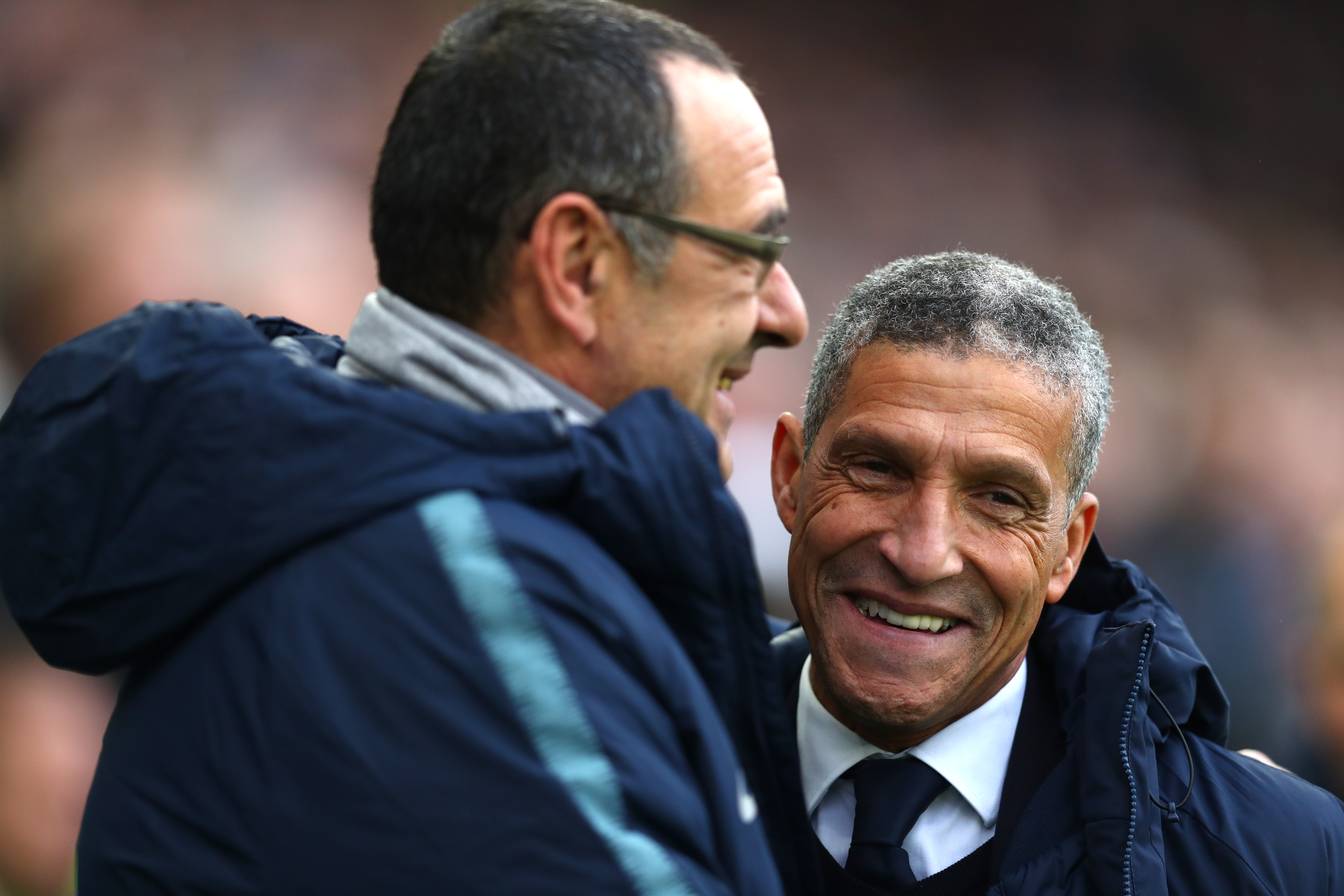 BRIGHTON, ENGLAND - DECEMBER 16: Chris Hughton, Manager of Brighton and Hove Albion and Maurizio Sarri, Manager of Chelsea embrace prior to the Premier League match between Brighton & Hove Albion and Chelsea FC at American Express Community Stadium on December 16, 2018 in Brighton, United Kingdom. (Photo by Dan Istitene/Getty Images)