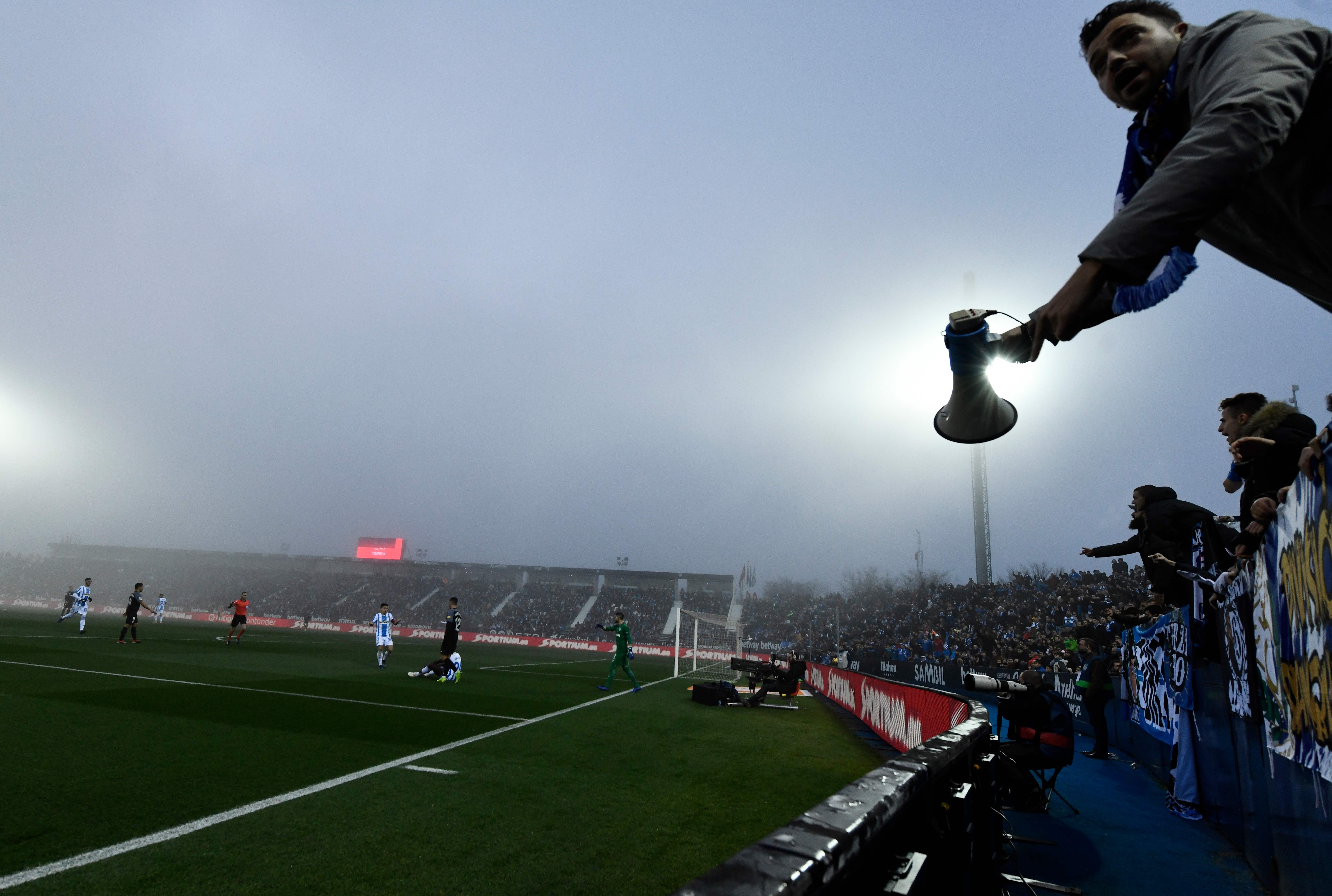 A Leganes fan holds a megaphone during the Spanish League football match between Club Deportivo Leganes SAD and Sevilla FC at the Estadio Municipal Butarque in Leganes on Decemeber 23, 2018. (Photo by OSCAR DEL POZO / AFP) (Photo credit should read OSCAR DEL POZO/AFP/Getty Images)