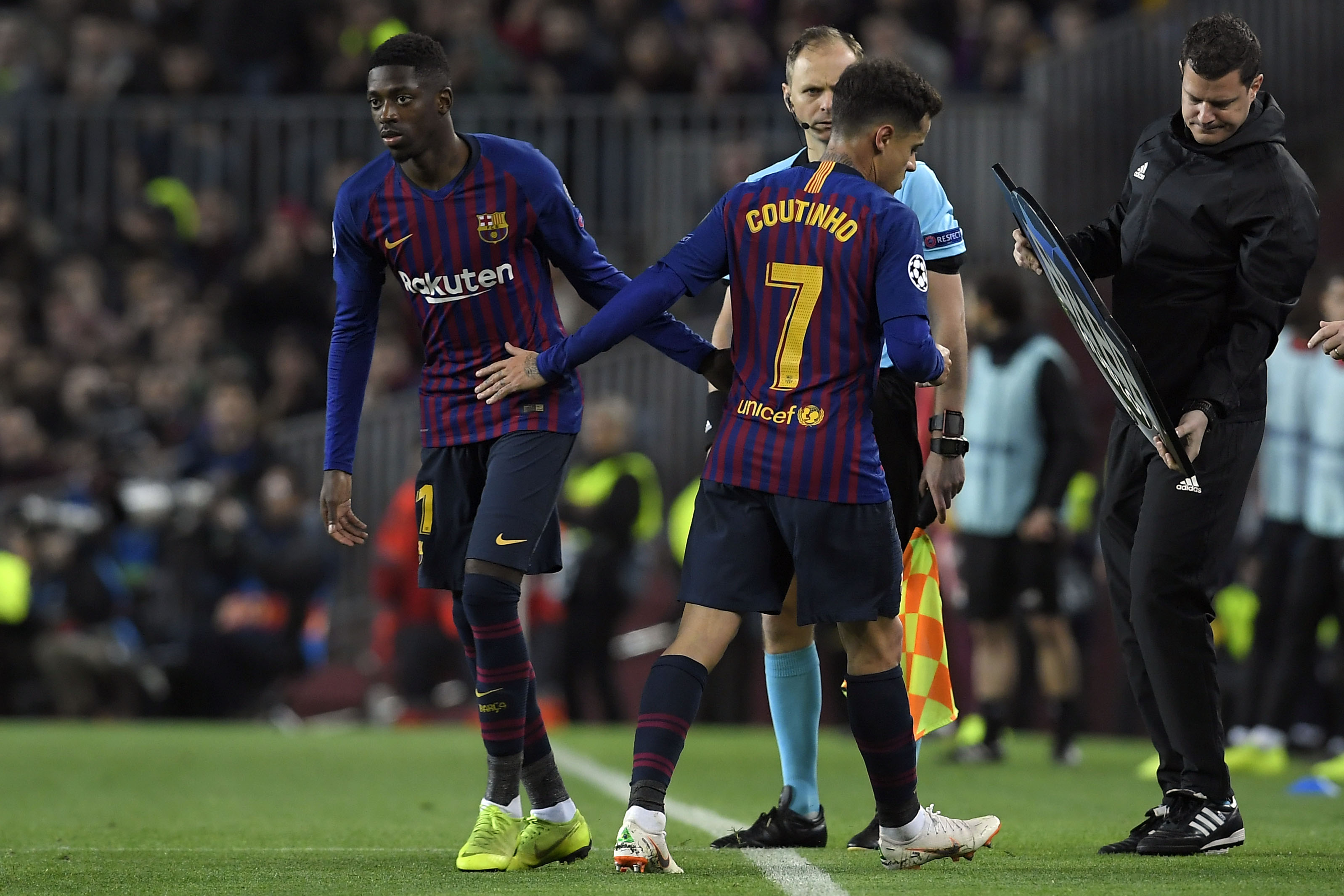 Barcelona's Brazilian midfielder Philippe Coutinho (C) greets Barcelona's French forward Ousmane Dembele (L) as he leaves the pitch during the UEFA Champions League round of 16, second leg football match between FC Barcelona and Olympique Lyonnais at the Camp Nou stadium in Barcelona on March 13, 2019. (Photo by LLUIS GENE / AFP) (Photo credit should read LLUIS GENE/AFP/Getty Images)
