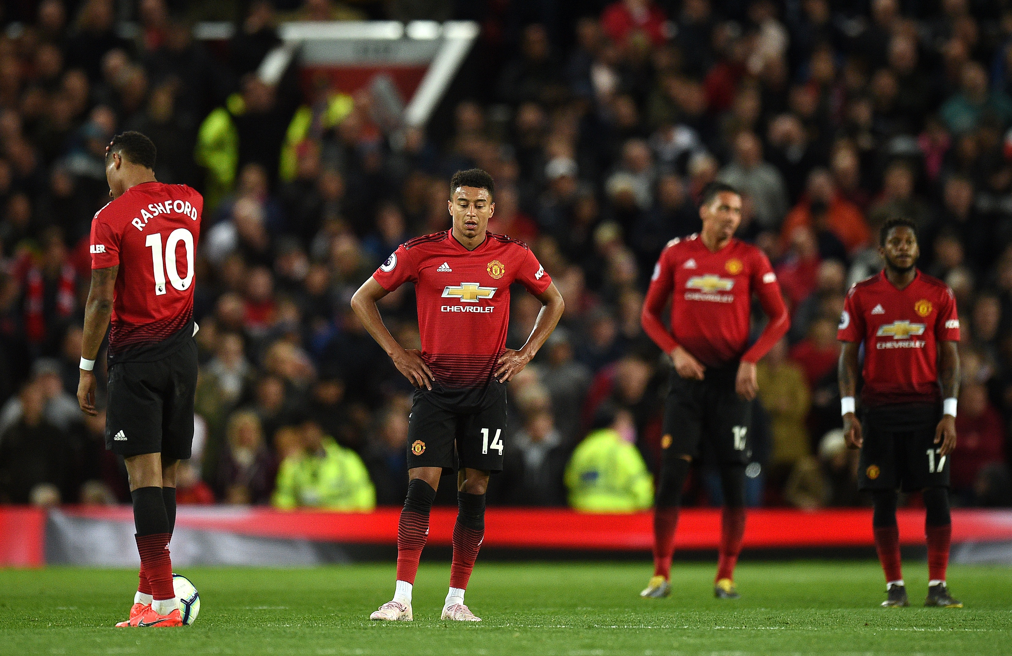 Manchester United's English forward Marcus Rashford (L), Manchester United's English midfielder Jesse Lingard (2L), Manchester United's English defender Chris Smalling (2R) and Manchester United's Brazilian midfielder Fred react after conceding a goal during the English Premier League football match between Manchester United and Manchester City at Old Trafford in Manchester, north west England, on April 24, 2019. (Photo by Oli SCARFF / AFP) / RESTRICTED TO EDITORIAL USE. No use with unauthorized audio, video, data, fixture lists, club/league logos or 'live' services. Online in-match use limited to 120 images. An additional 40 images may be used in extra time. No video emulation. Social media in-match use limited to 120 images. An additional 40 images may be used in extra time. No use in betting publications, games or single club/league/player publications. / (Photo credit should read OLI SCARFF/AFP/Getty Images)