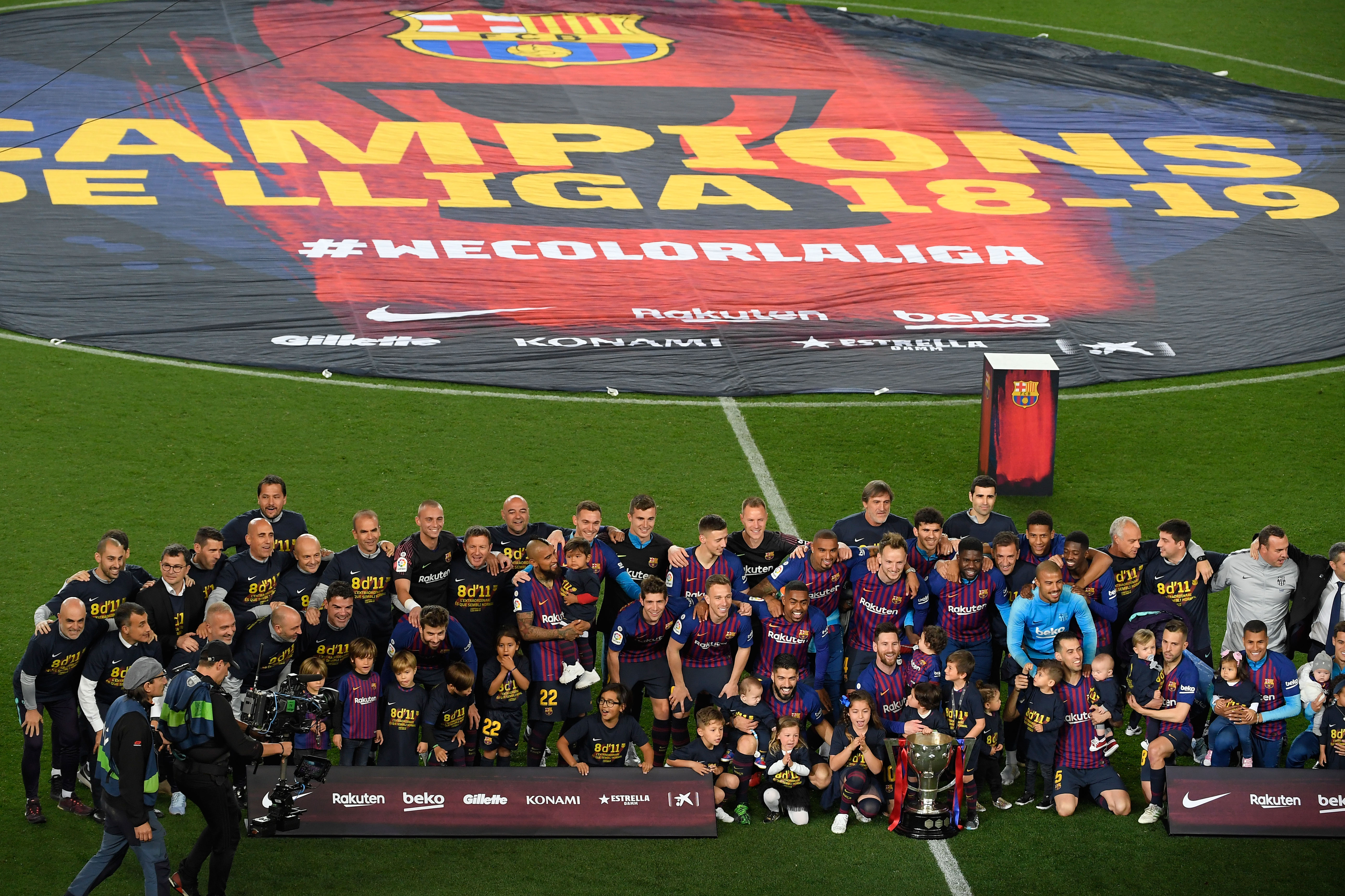 Barcelona team celebrates becoming La Liga champions after winning the Spanish League football match between FC Barcelona and Levante UD at the Camp Nou stadium in Barcelona on April 27, 2019. - Lionel Messi clinched an eighth La Liga title for Barcelona in 11 seasons today as he scored the only goal in a 1-0 win over Levante. It is the Catalan club's 26th league title -- second in Spain to Real Madrid's record of 33. (Photo by LLUIS GENE / AFP) (Photo credit should read LLUIS GENE/AFP/Getty Images)