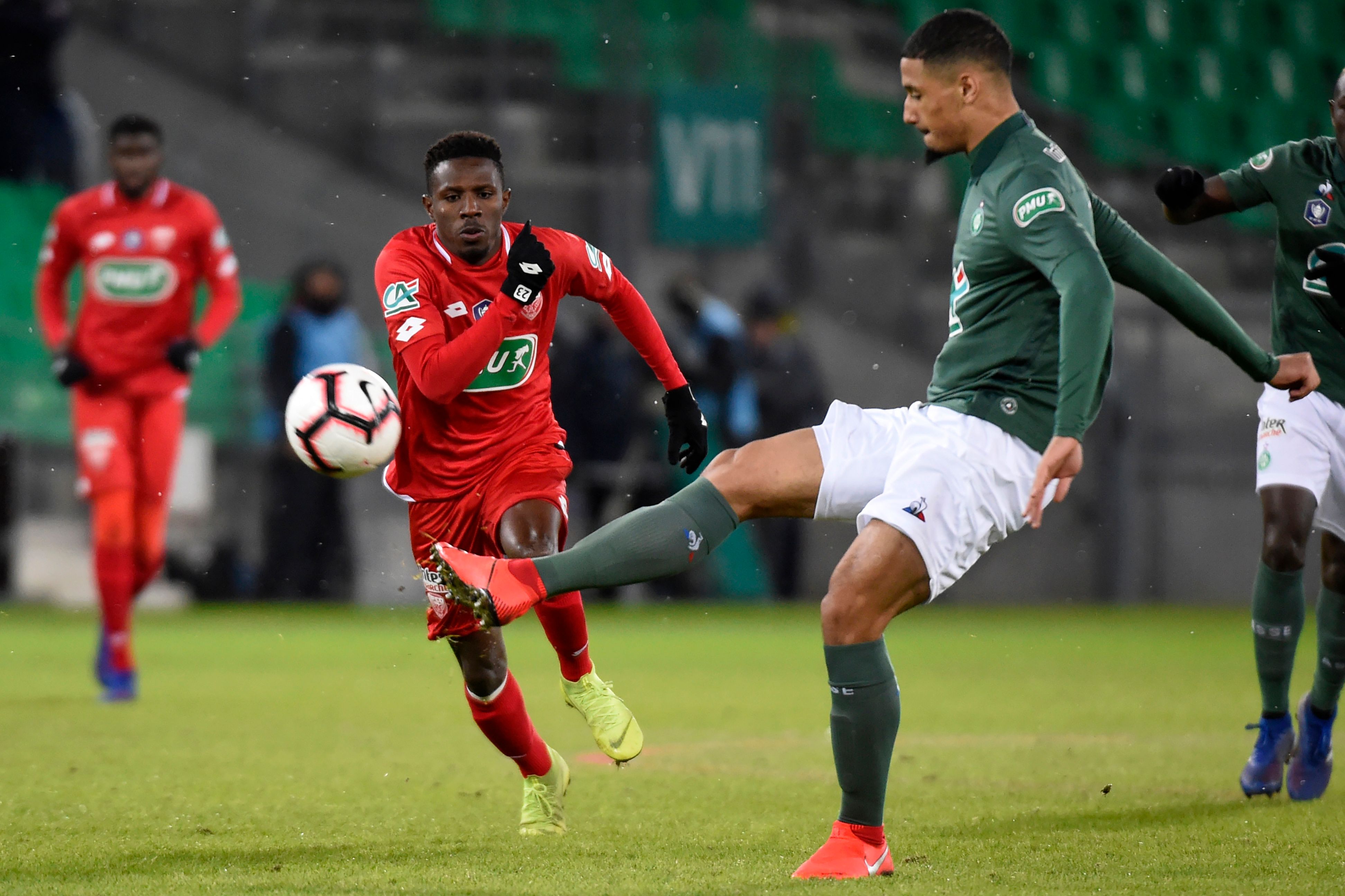 Dijon's Guinean midfielder Jules Keita (L) vies with Saint-Etienne's French forward William Saliba (R) during the French Cup round of 32 football match between Saint-Etienne (L1) and Dijon (L1), on January 23, 2019, at the Geoffroy Guichard Stadium in Saint-Etienne, central France. (Photo by JEAN-PHILIPPE KSIAZEK / AFP) (Photo credit should read JEAN-PHILIPPE KSIAZEK/AFP/Getty Images)
