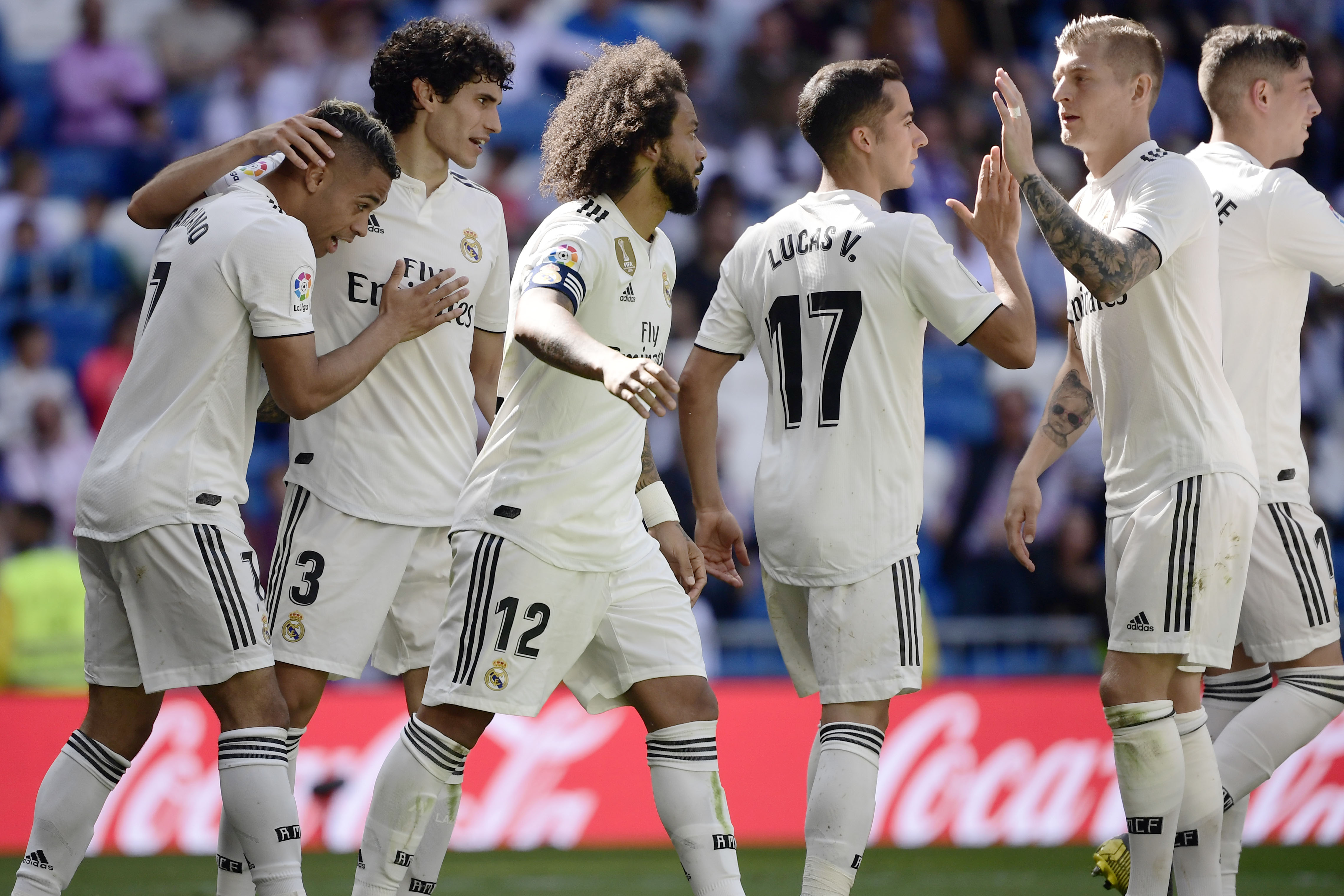 Real Madrid's Spanish-Dominican forward Mariano (L) celebrates his second goal with teammates during the Spanish league football match between Real Madrid CF and Villarreal CF at the Santiago Bernabeu stadium in Madrid on May 5, 2019. (Photo by JAVIER SORIANO / AFP) (Photo credit should read JAVIER SORIANO/AFP/Getty Images)