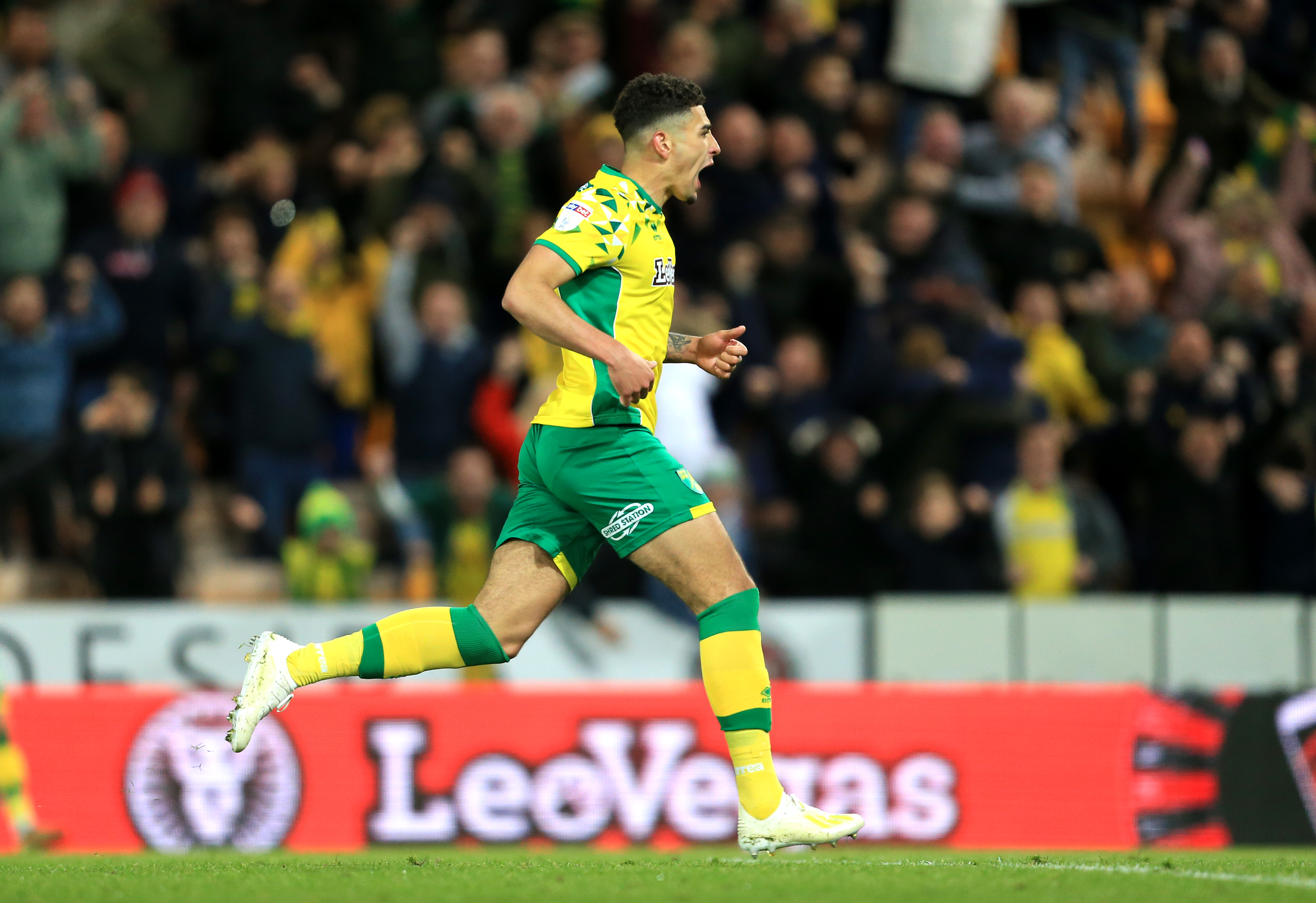 NORWICH, ENGLAND - APRIL 10: Ben Godfrey of Norwich City celebrates after scoring his team's first goal during the Sky Bet Championship match between Norwich City and Reading at Carrow Road on April 10, 2019 in Norwich, England. (Photo by Stephen Pond/Getty Images)