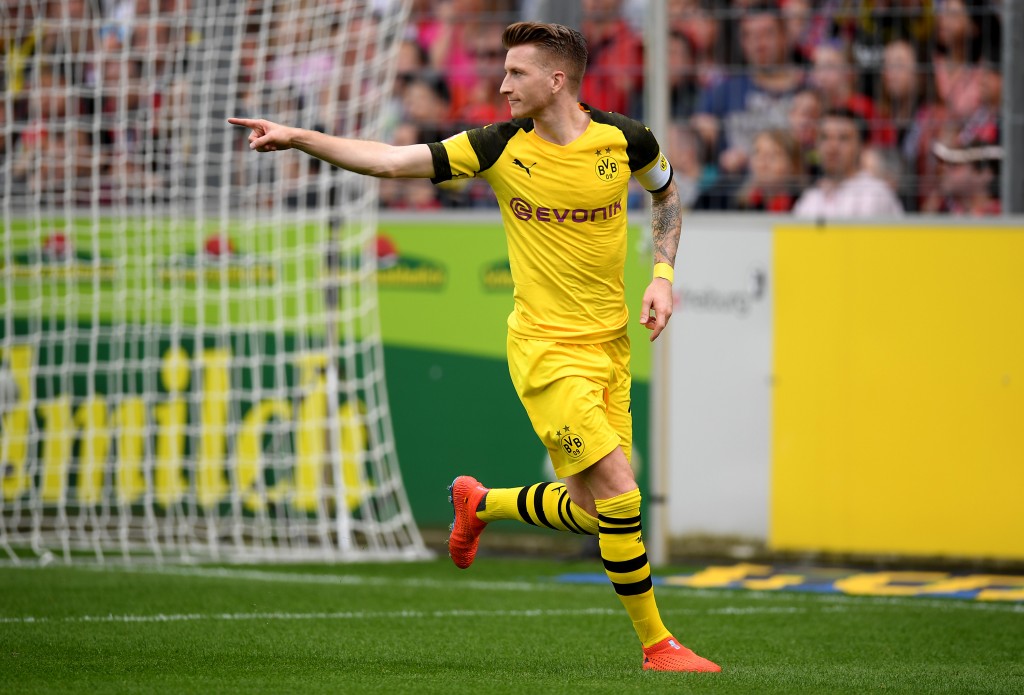 FREIBURG IM BREISGAU, GERMANY - APRIL 21: Marco Reus of Dortmund celebrates after he scores the 2nd goal during the Bundesliga match between Sport-Club Freiburg and Borussia Dortmund at Schwarzwald-Stadion on April 21, 2019 in Freiburg im Breisgau, Germany. (Photo by Christian Kaspar-Bartke/Bongarts/Getty Images)