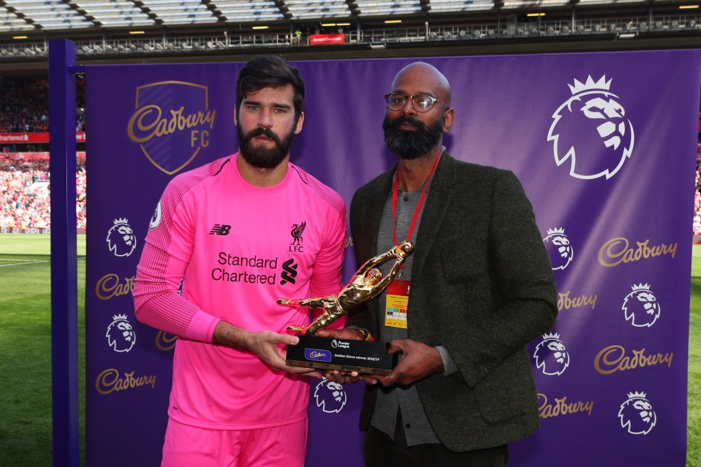 LIVERPOOL, ENGLAND - MAY 12: Alisson of Liverpool poses for a photo with the golden glove award after the Premier League match between Liverpool FC and Wolverhampton Wanderers at Anfield on May 12, 2019 in Liverpool, United Kingdom. (Photo by Catherine Ivill/Getty Images)
