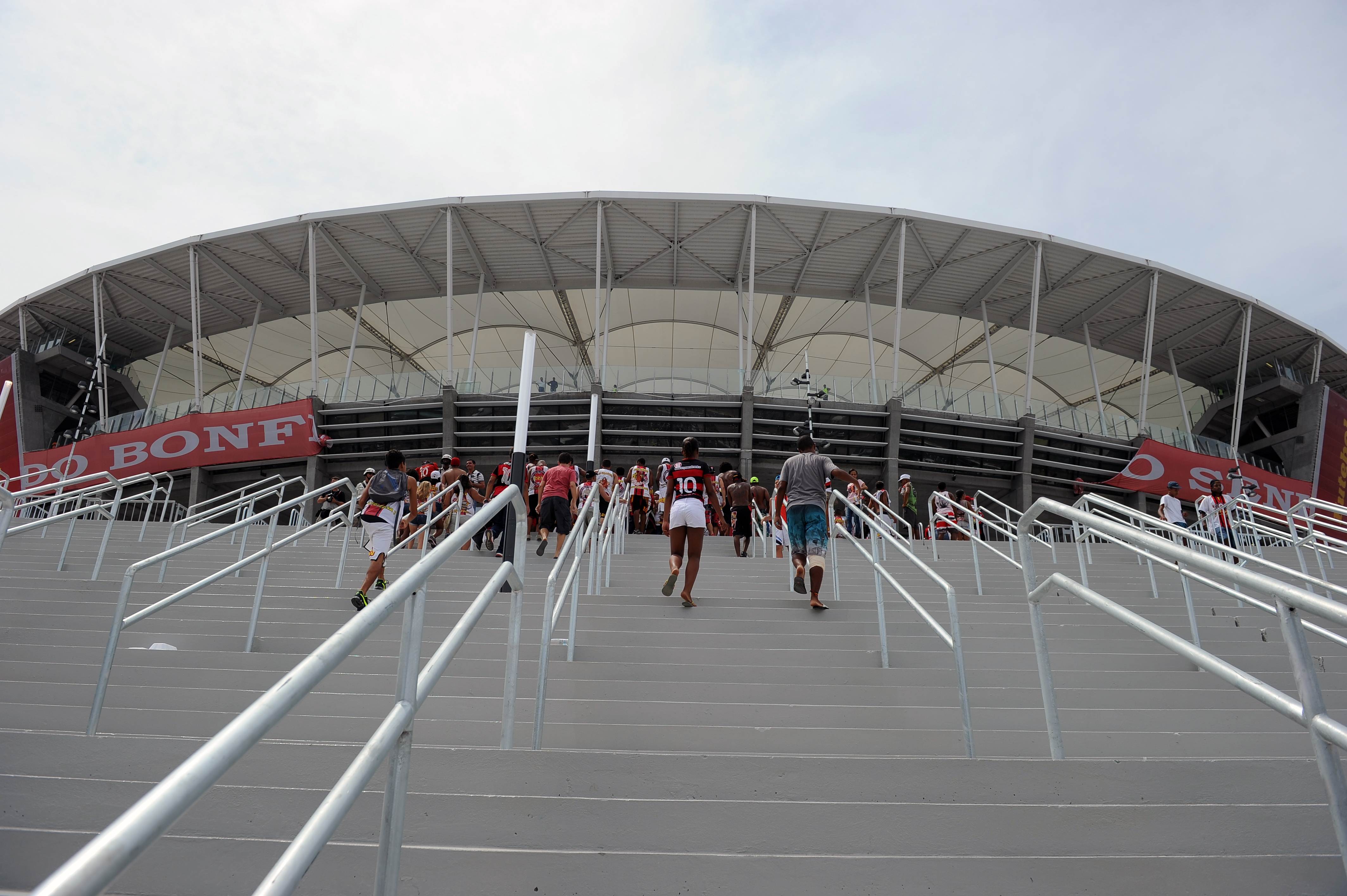 Brazilian football fans arrive to the "Arena Fonte Nova" stadium during its official inauguration in Salvador de Bahia, Brazil on April 7, 2013, where Esporte Club Bahia will face Esporte Club Vitoria of the Baiano Championship. Fonte Nova Arena is the third stadium to be finished ahead of the 2013 FIFA Confederation Cup, which will start on June 2013, and the FIFA World Cup in 2014. AFP PHOTO/VANDERLEI ALMEIDA (Photo credit should read VANDERLEI ALMEIDA/AFP/Getty Images)