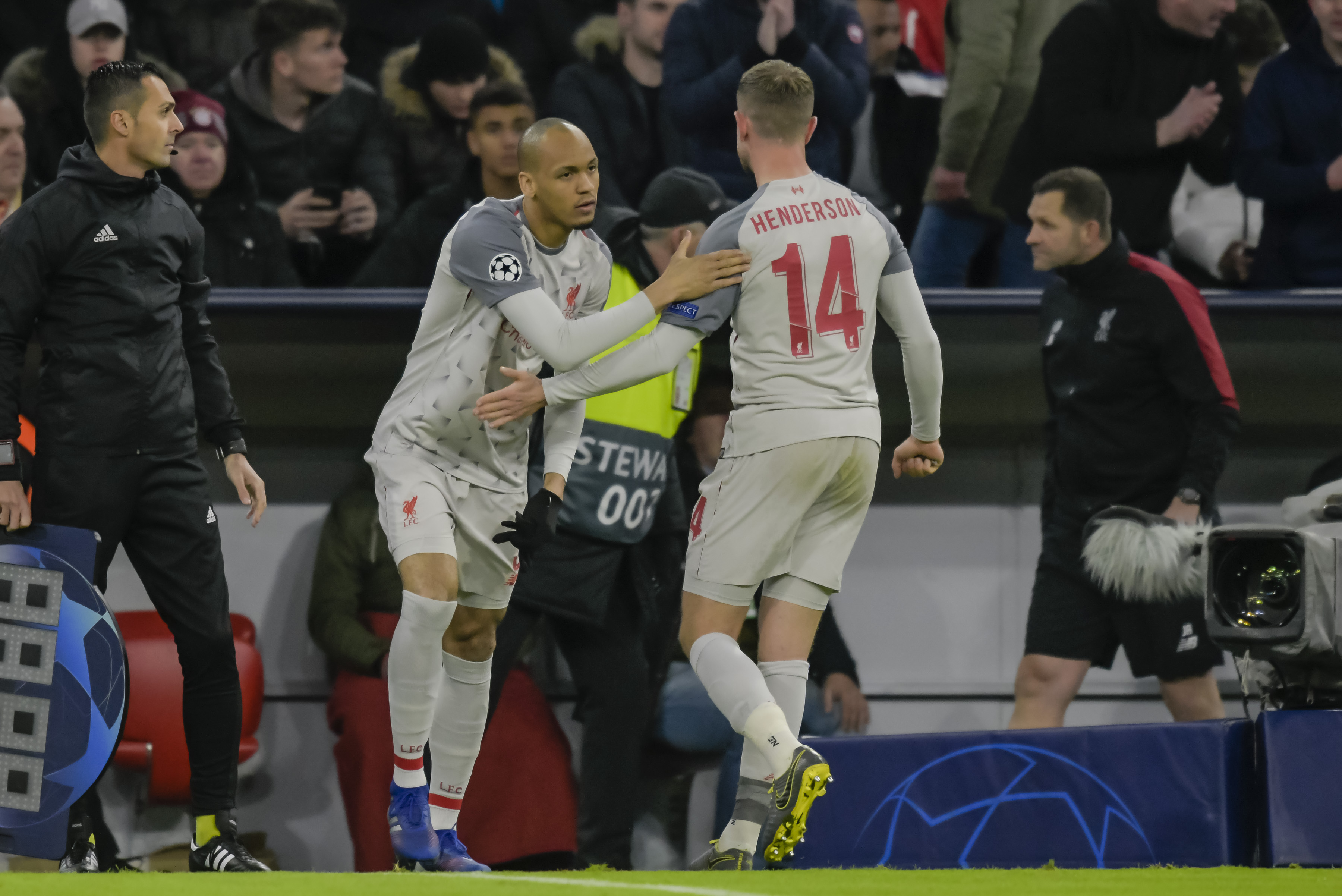 Liverpool's Brazilian midfielder Fabinho comes on for Liverpool's injured English midfielder Jordan Henderson (R) during the UEFA Champions League, last 16, second leg football match Bayern Munich v Liverpool in Munich, southern Germany, on March 13, 2019. (Photo by GUENTER SCHIFFMANN / AFP) (Photo credit should read GUENTER SCHIFFMANN/AFP/Getty Images)