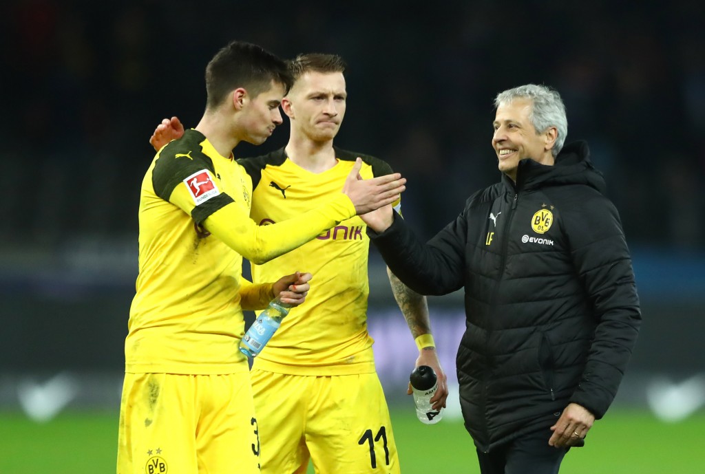 BERLIN, GERMANY - MARCH 16: (L-R) Julian Weigl, Marco Reus and Lucien Favre, Manager of Borussia Dortmund celebrate victory following the Bundesliga match between Hertha BSC and Borussia Dortmund at Olympiastadion on March 16, 2019 in Berlin, Germany. (Photo by Martin Rose/Bongarts/Getty Images)