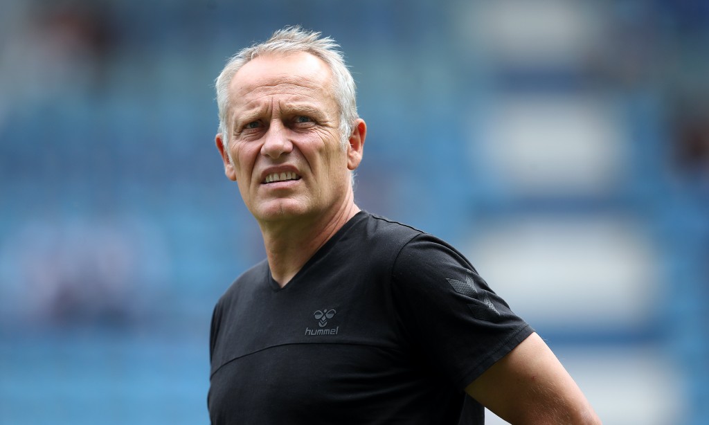MAGDEBURG, GERMANY - AUGUST 10: Head coach Christian Streich enters the pitch prior to the DFB Cup first round match between 1. FC Magdeburg and SC Freiburg at MDCC Arena on August 10, 2019 in Magdeburg, Germany. (Photo by Ronny Hartmann/Bongarts/Getty Images)