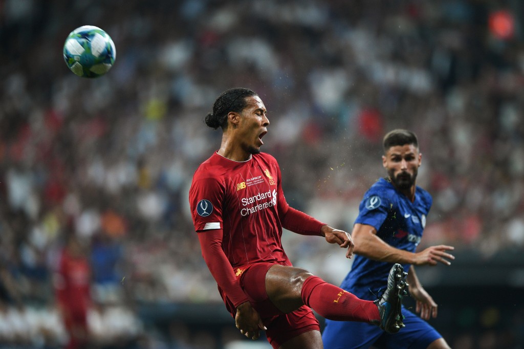 Giroud had the measure of van Dijk at times. (Photo by Bulent Kilic/AFP/Getty Images)