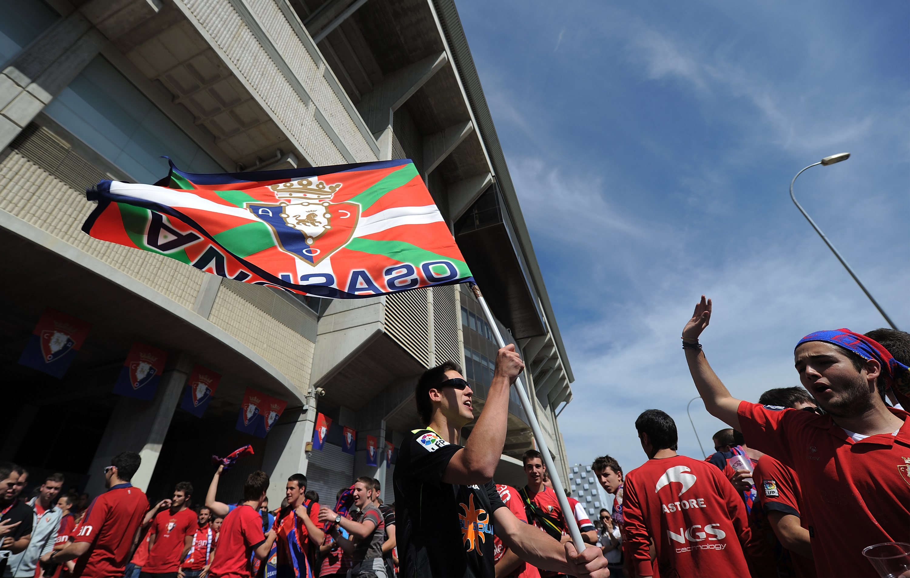 PAMPLONA, SPAIN - MAY 18: CA Osasuns cheer while outside their stadium prior to the start of the La Liga match between CA Osasuna and Real Betis Balompie at Estadio Reyno de Navarra on May 18, 2014 in Pamplona, Spain. (Photo by Denis Doyle/Getty Images)