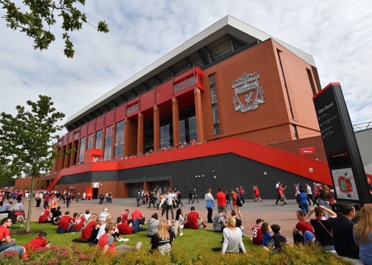 Fans gather outside the stadium in the sunshine ahead of the English Premier League football match between Liverpool and Arsenal at Anfield in Liverpool, north west England on August 27, 2017. / AFP PHOTO / Anthony DEVLIN / RESTRICTED TO EDITORIAL USE. No use with unauthorized audio, video, data, fixture lists, club/league logos or 'live' services. Online in-match use limited to 75 images, no video emulation. No use in betting, games or single club/league/player publications. / (Photo credit should read ANTHONY DEVLIN/AFP/Getty Images)