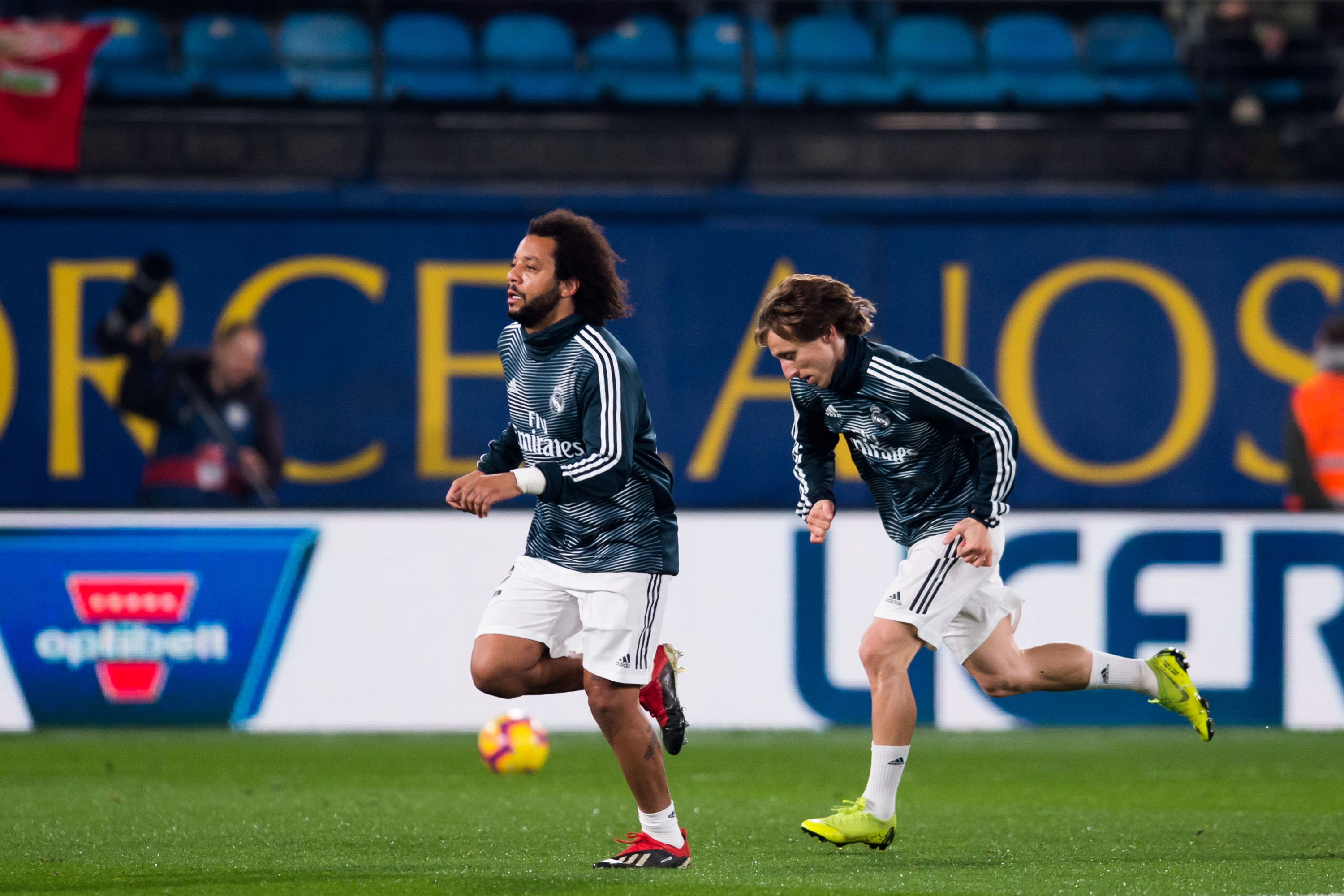 VILLAREAL, SPAIN - JANUARY 03: Marcelo and Luka Modric of Real Madrid CF warm up prior to the La Liga match between Villarreal CF and Real Madrid CF at Estadio de la Ceramica on January 03, 2019 in Villarreal, Spain. (Photo by Alex Caparros/Getty Images)
