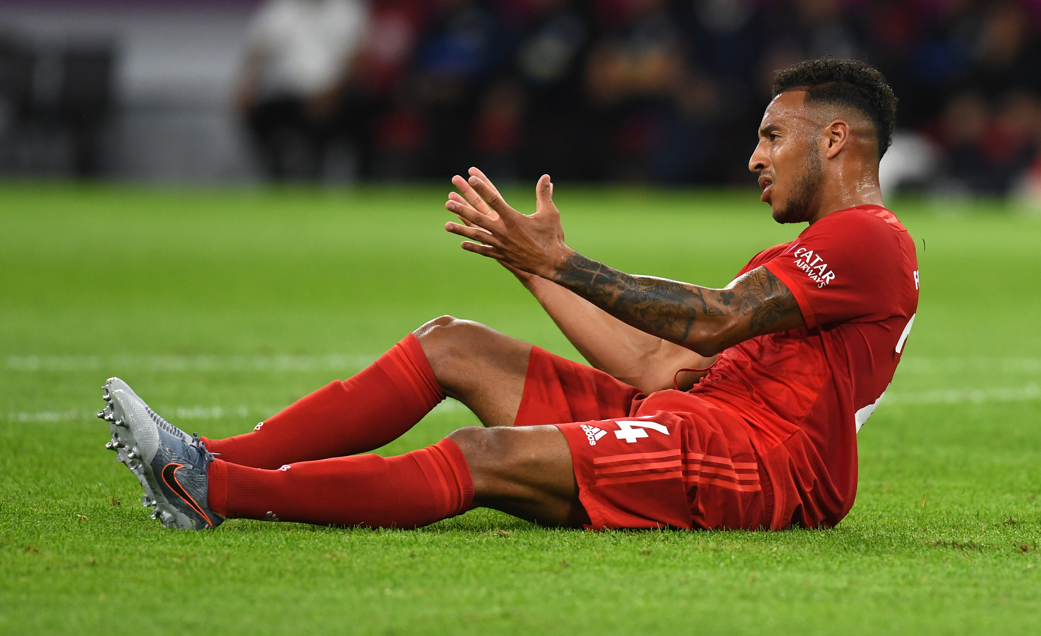 Bayern Munich's French midfielder Corentin Tolisso ends up on the grass after a foul during the German First division Bundesliga football match FC Bayern Munich v Hertha Berlin in Munich, southern Germany, on August 16, 2019. (Photo by Christof STACHE / AFP) / DFL REGULATIONS PROHIBIT ANY USE OF PHOTOGRAPHS AS IMAGE SEQUENCES AND/OR QUASI-VIDEO        (Photo credit should read CHRISTOF STACHE/AFP/Getty Images)