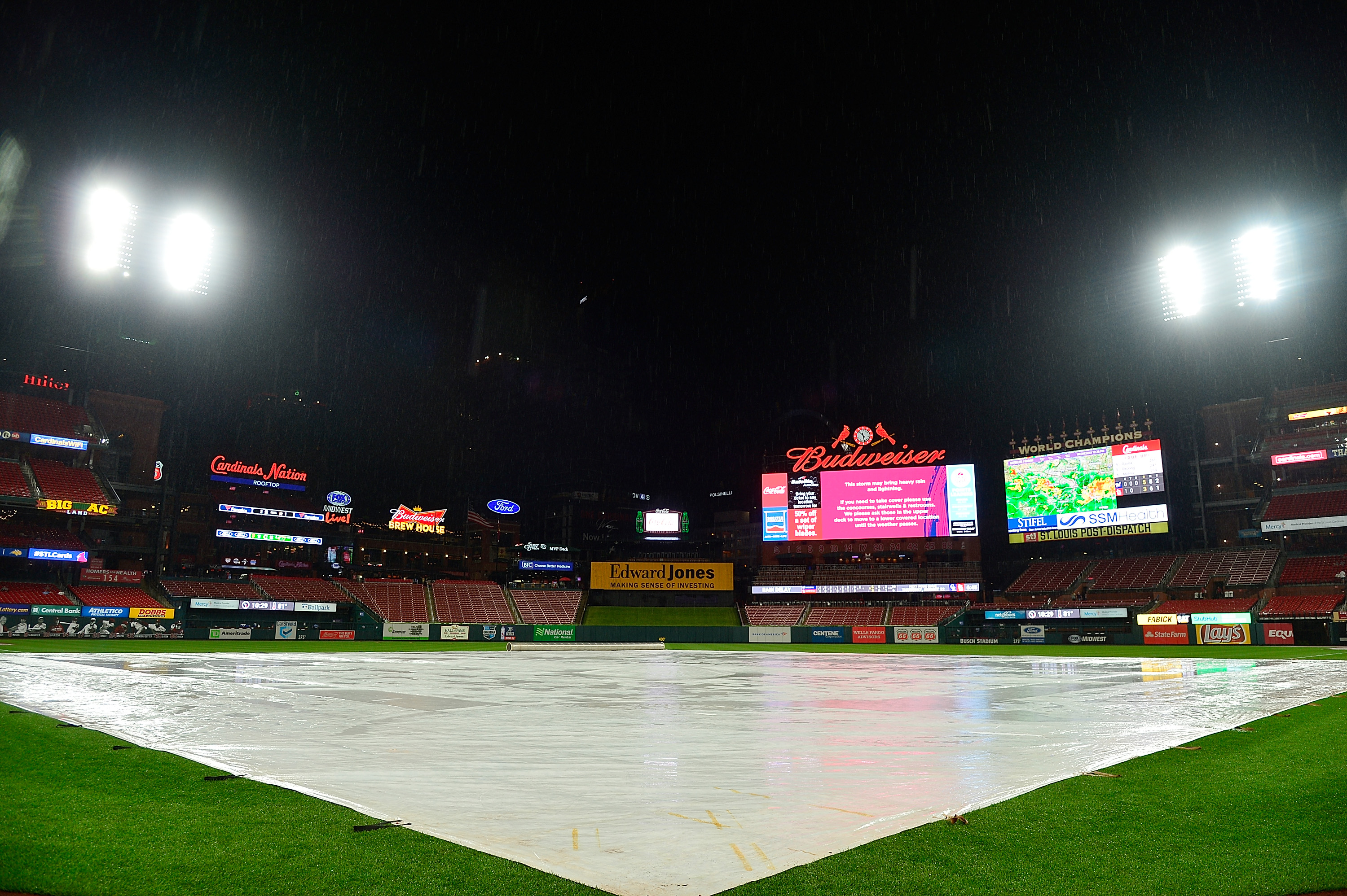 ST LOUIS, MO - AUGUST 21: General view of Busch Stadium with the tarp on the field after rain came through the area during the eighth inning on August 21, 2019 in St Louis, Missouri. The game was called due to weather and the Milwaukee Brewers defeated the St. Louis Cardinals 5-3. (Photo by Jeff Curry/Getty Images)