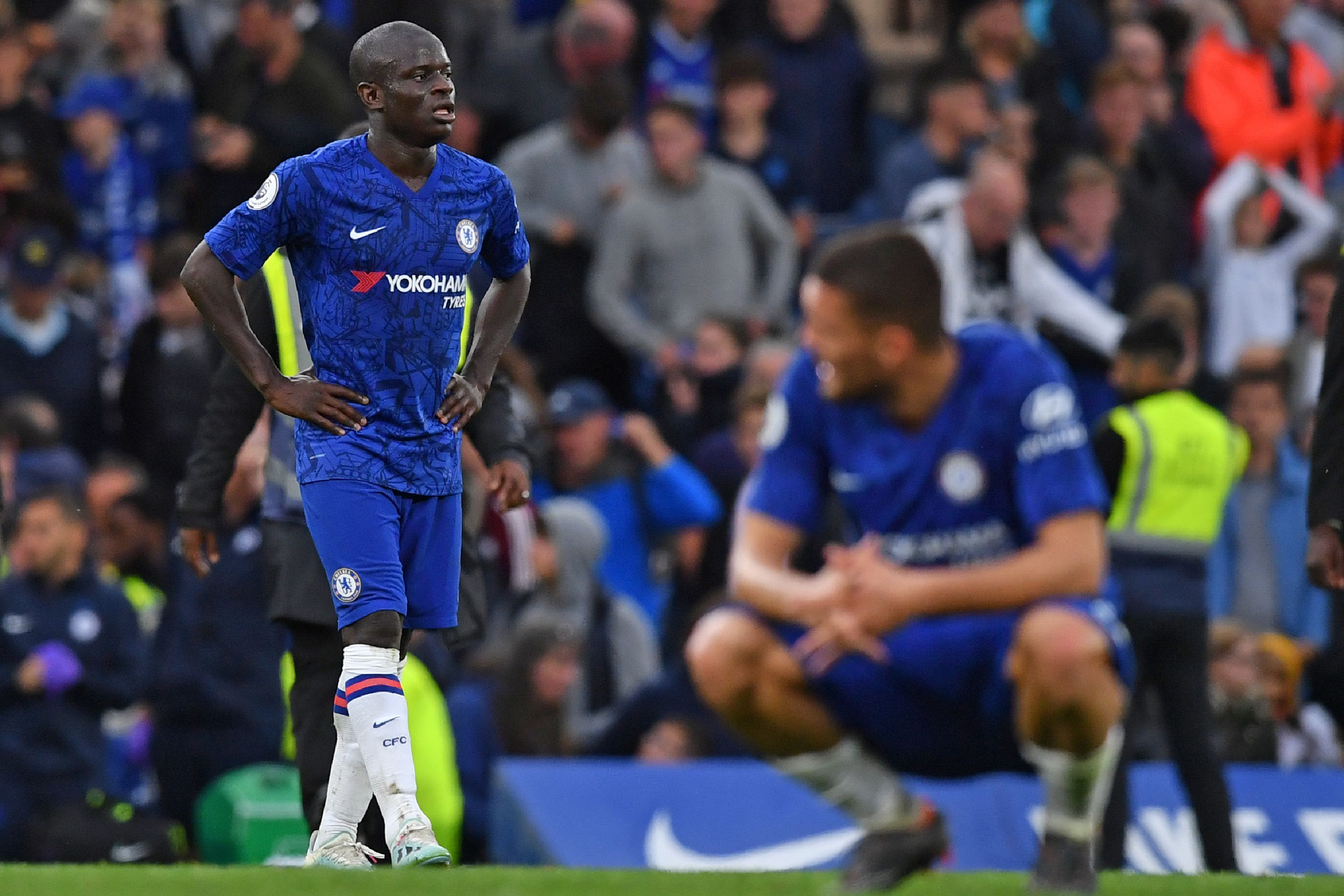 Chelsea's French midfielder N'Golo Kante and teammates react to their defeat on the final whistle in the English Premier League football match between Chelsea and Liverpool at Stamford Bridge in London on September 22, 2019. - Liverpool won the game 2-1. (Photo by Ben STANSALL / AFP) / RESTRICTED TO EDITORIAL USE. No use with unauthorized audio, video, data, fixture lists, club/league logos or 'live' services. Online in-match use limited to 120 images. An additional 40 images may be used in extra time. No video emulation. Social media in-match use limited to 120 images. An additional 40 images may be used in extra time. No use in betting publications, games or single club/league/player publications. /         (Photo credit should read BEN STANSALL/AFP/Getty Images)