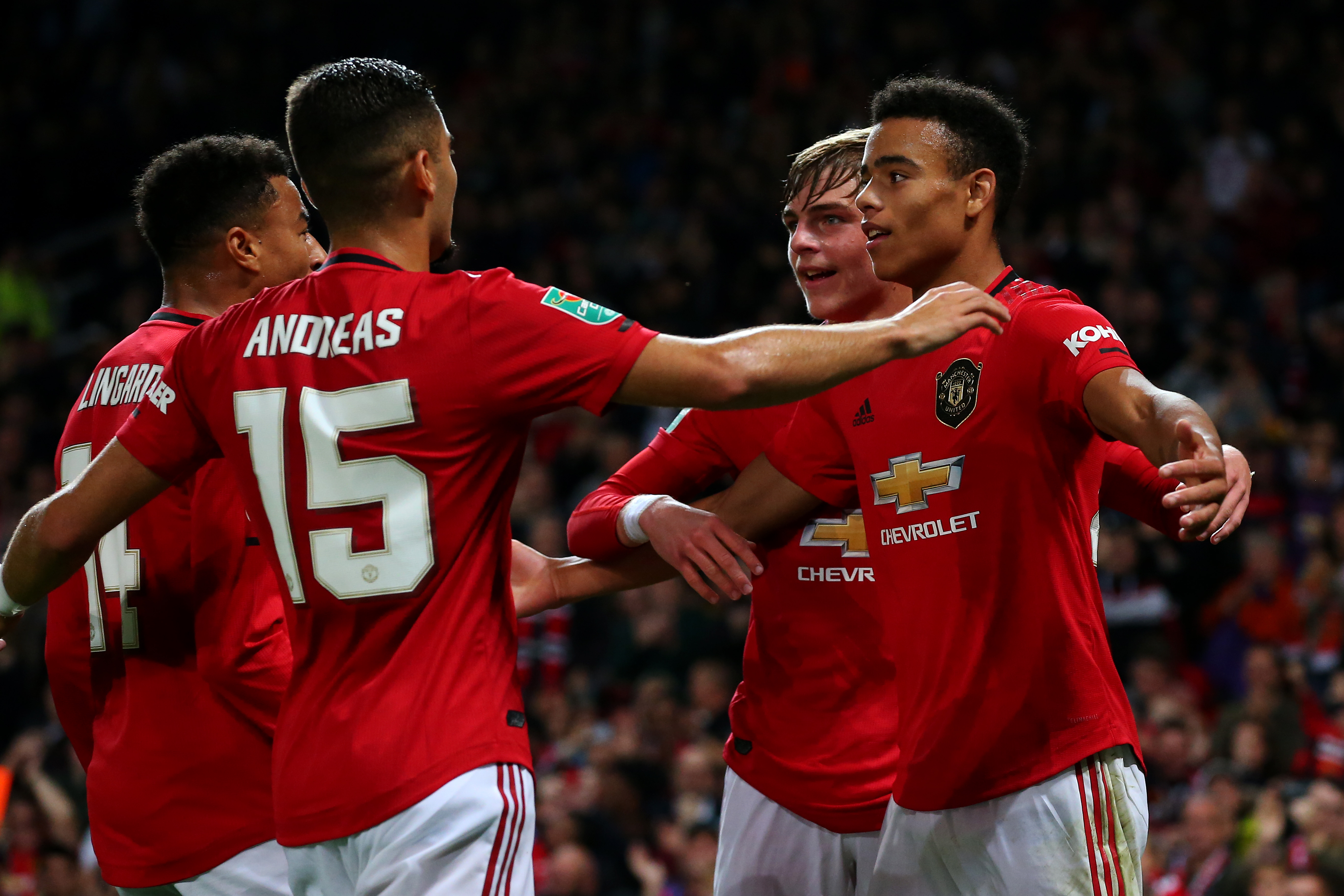 MANCHESTER, ENGLAND - SEPTEMBER 25: Mason Greenwood of Manchester United celebrates scoring his teams first goal of the game with team mate Brandon Williams during the Carabao Cup Third Round match between Manchester United and Rochdale AFC at Old Trafford on September 25, 2019 in Manchester, England. (Photo by Alex Livesey/Getty Images)