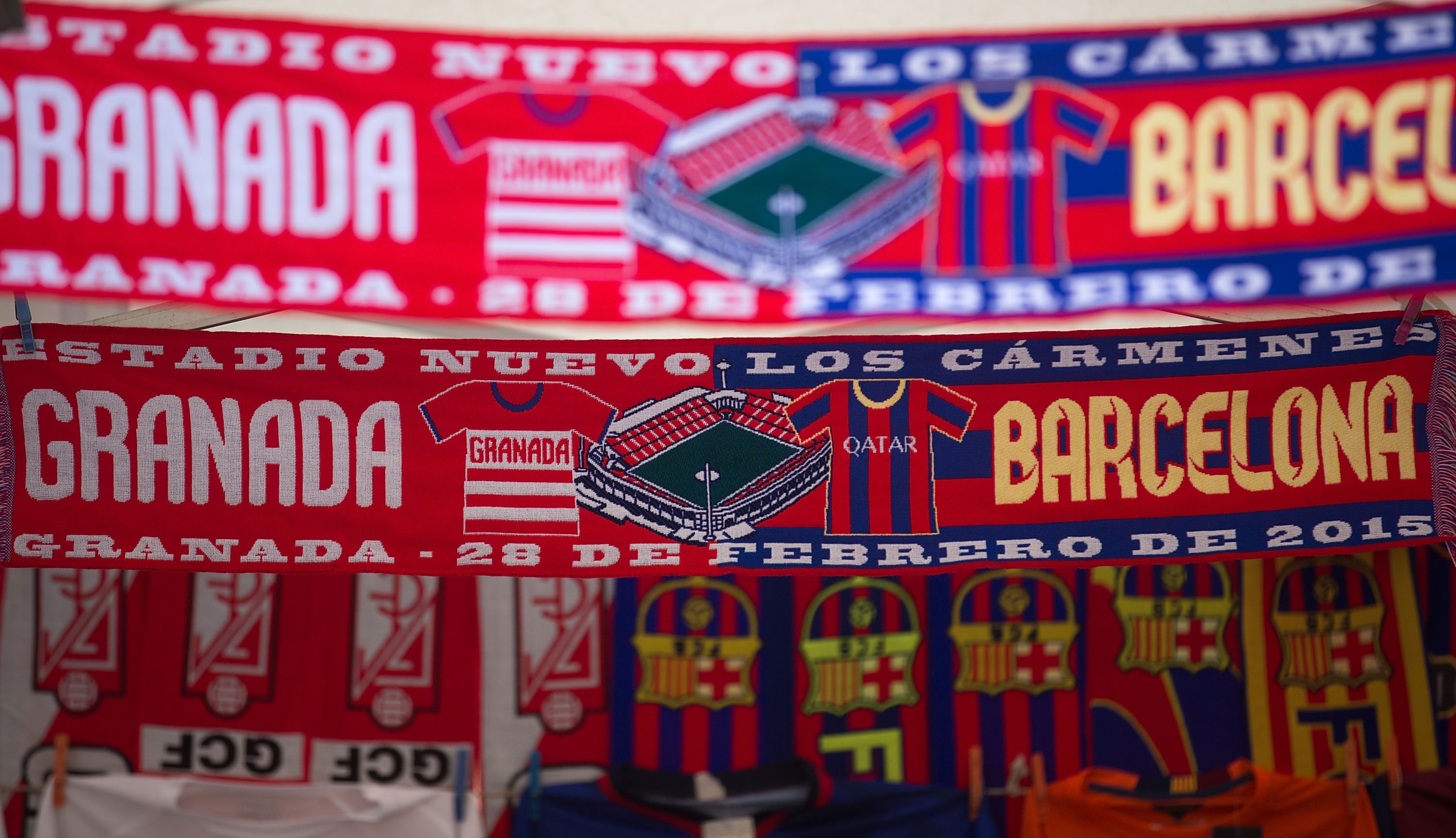 GRANADA, SPAIN - FEBRUARY 28: The Match,s scarf is displayed at a merchandaising stall outside Nuevo Estadio de los Carmenes before the La Liga match between Granada CF and FC Barcelona on February 28, 2015 in Granada, Spain. (Photo by Gonzalo Arroyo Moreno/Getty Images)