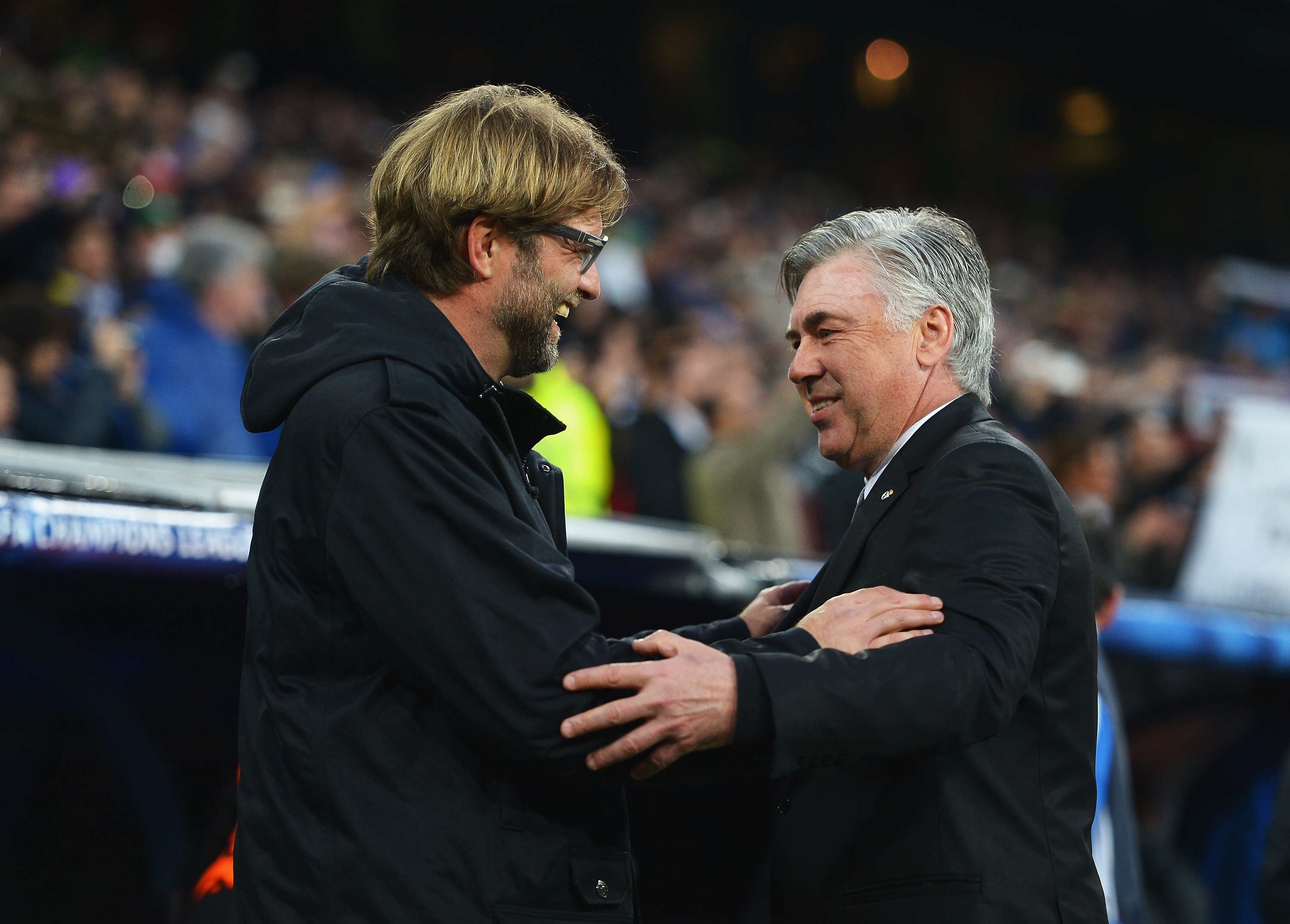 MADRID, SPAIN - APRIL 02: Juergen Klopp (L), coach of Borussia Dortmund is greeted by Carlo Ancelotti, coach of Real Madrid during the UEFA Champions League Quarter Final first leg match between Real Madrid and Borussia Dortmund at Estadio Santiago Bernabeu on April 2, 2014 in Madrid, Spain. (Photo by Dennis Grombkowski/Bongarts/Getty Images)