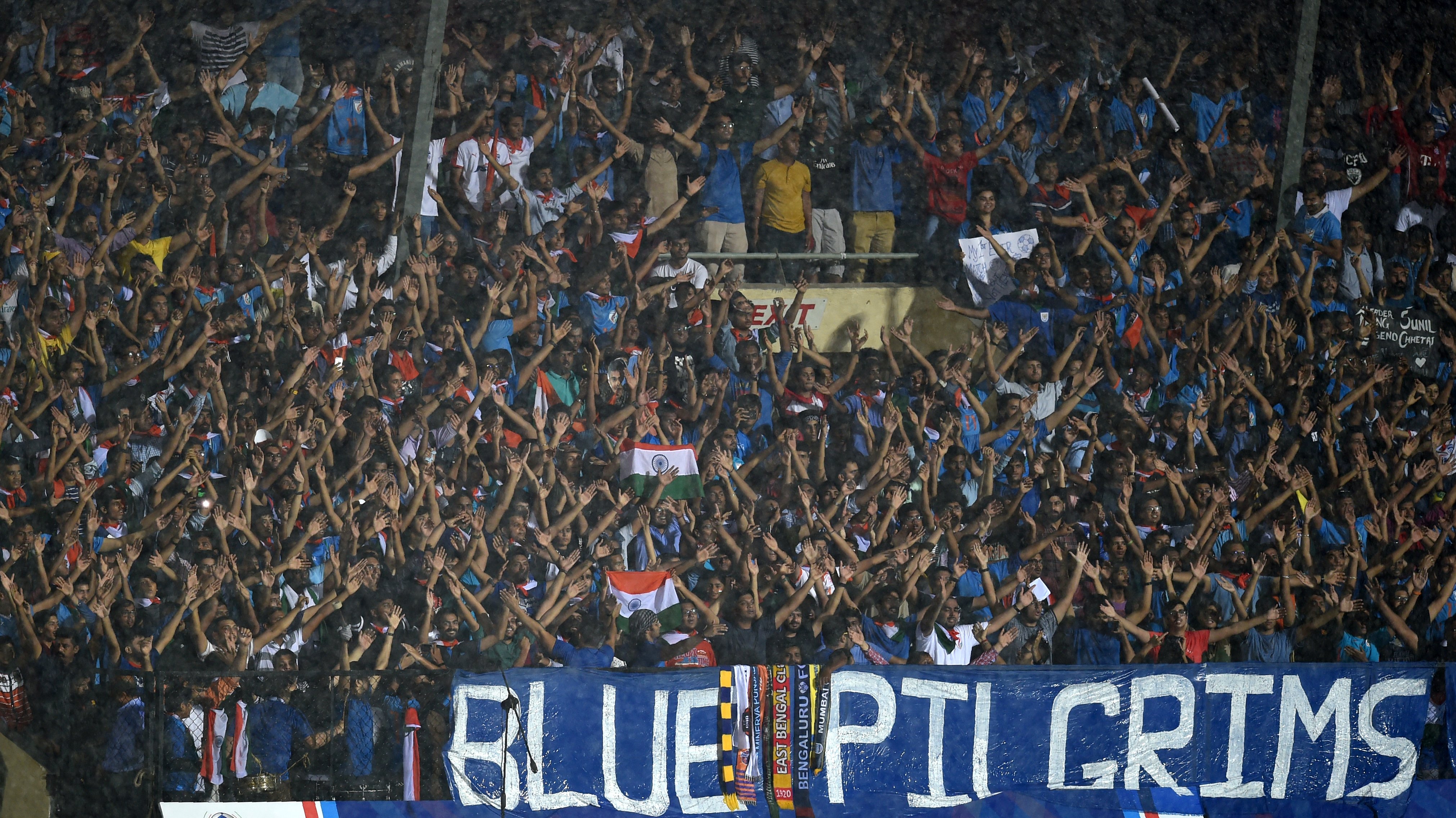 Indian fans attend the Hero Intercontinental Cup football match between India and Kenya in Mumbai on June 4, 2018. - India's football international against Kenya on June 4 was sold out in hours following captain Sunil Chhetri's emotional plea for fans to support the team after barely 2,500 people turned up to watch them play last week. (Photo by PUNIT PARANJPE / AFP) (Photo credit should read PUNIT PARANJPE/AFP/Getty Images)