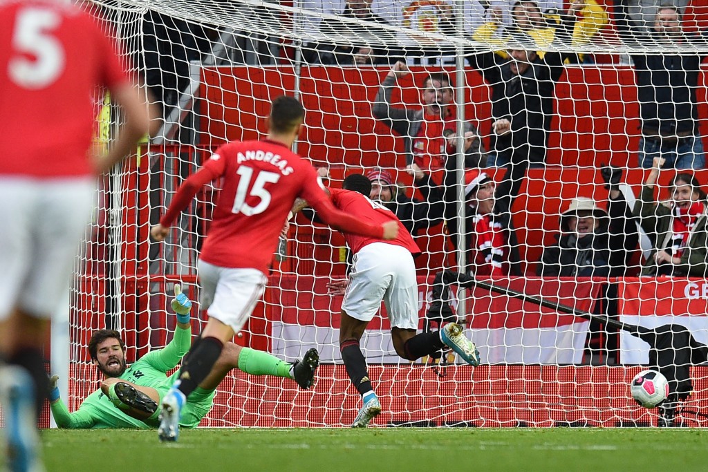 Alisson could not keep a clean sheet on his return (Photo by OLI SCARFF/AFP via Getty Images)