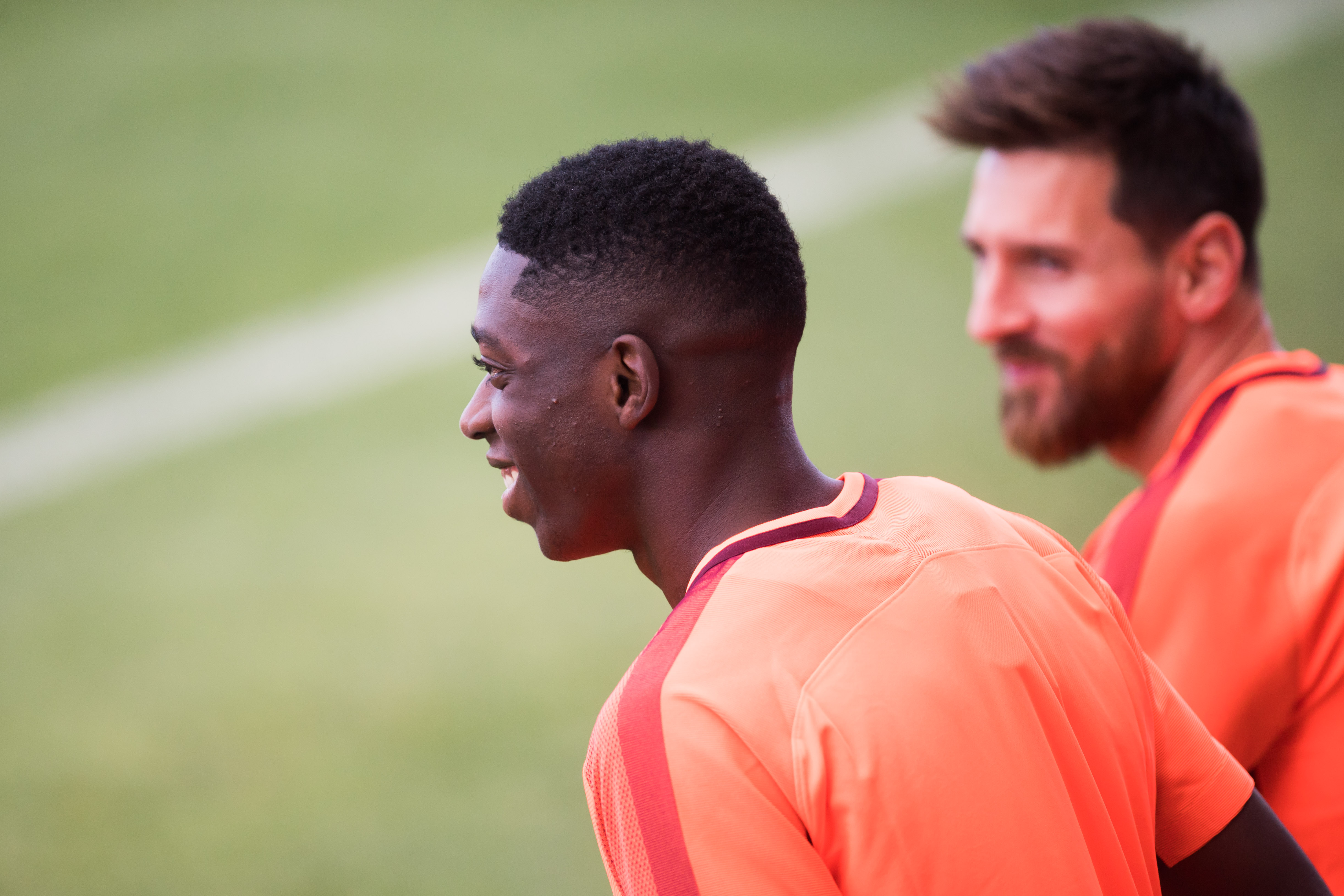 BARCELONA, SPAIN - SEPTEMBER 11: Ousmane Dembele of Lionel Messi of FC Barcelona enter the pitch during a training session ahead of the UEFA Champions League Group D match against Juventus on September 11, 2017 in Barcelona, Spain. (Photo by Alex Caparros/Getty Images)