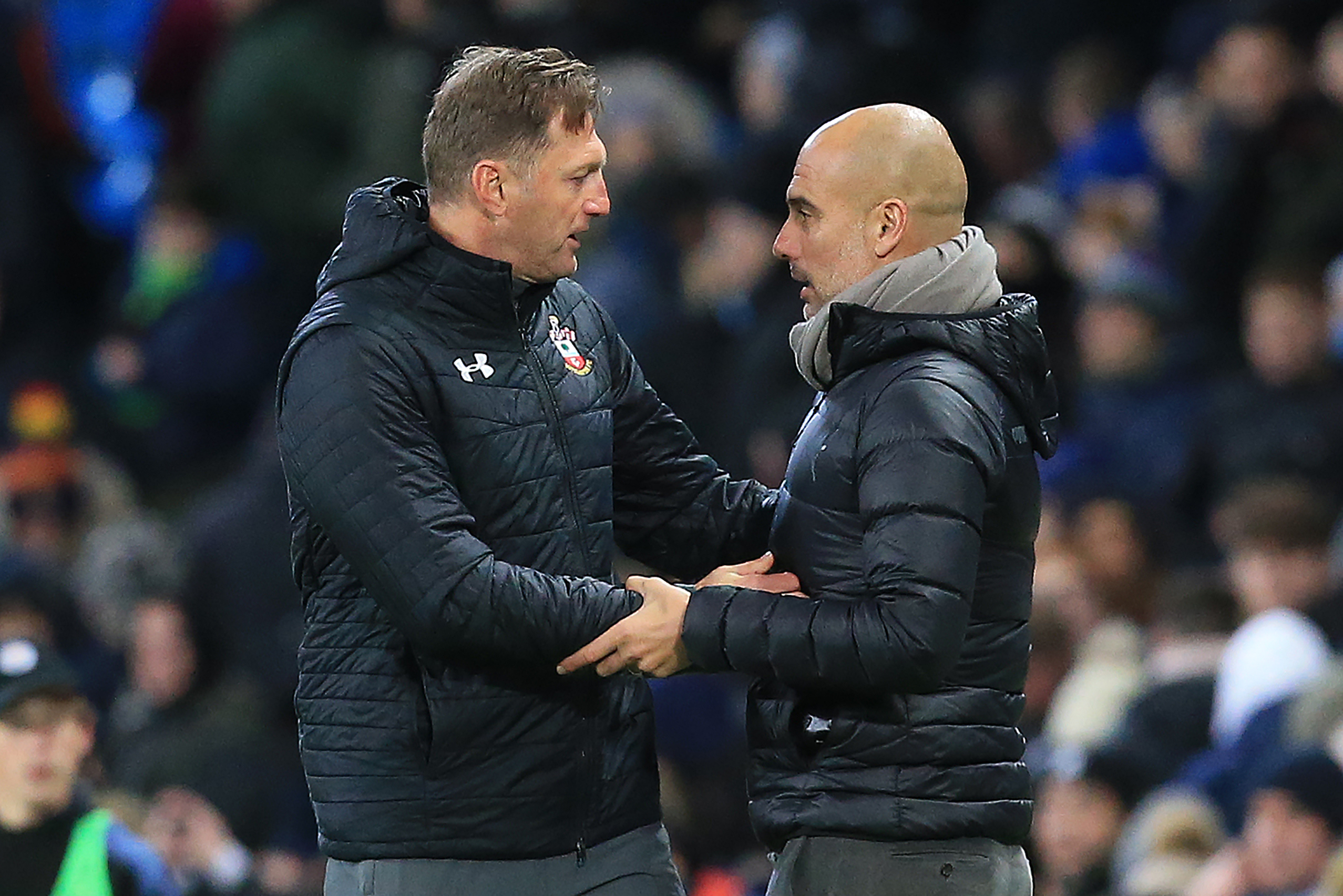 Manchester City's Spanish manager Pep Guardiola (R) talks with Southampton's Austrian manager Ralph Hasenhuttl after the English League Cup fourth round football match between Manchester City and Southampton at the Etihad Stadium in Manchester, north west England, on October 29, 2019. - Manchester City won the match 3-1. (Photo by Lindsey Parnaby / AFP) / RESTRICTED TO EDITORIAL USE. No use with unauthorized audio, video, data, fixture lists, club/league logos or 'live' services. Online in-match use limited to 75 images, no video emulation. No use in betting, games or single club/league/player publications. / (Photo by LINDSEY PARNABY/AFP via Getty Images)