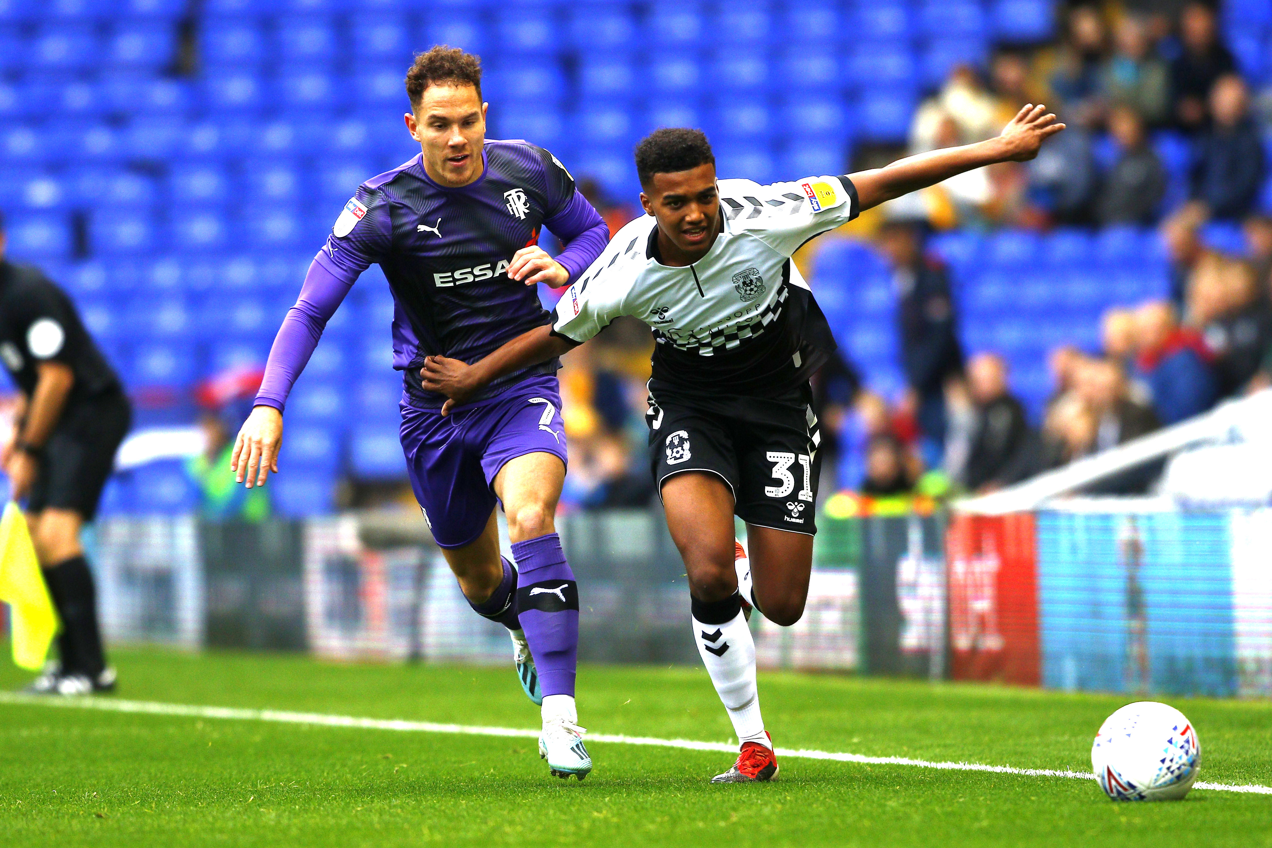 COVENTRY, ENGLAND - OCTOBER 13: Sam McCallum of Coventry City is challenged by Kieron Morris of Tranmere Rovers during the Sky Bet League One match between Coventry City and Tranmere Rovers at St Andrews Trillion Trophy's Stadium on October 13, 2019 in Coventry, England. (Photo by Morgan Harlow/Getty Images)