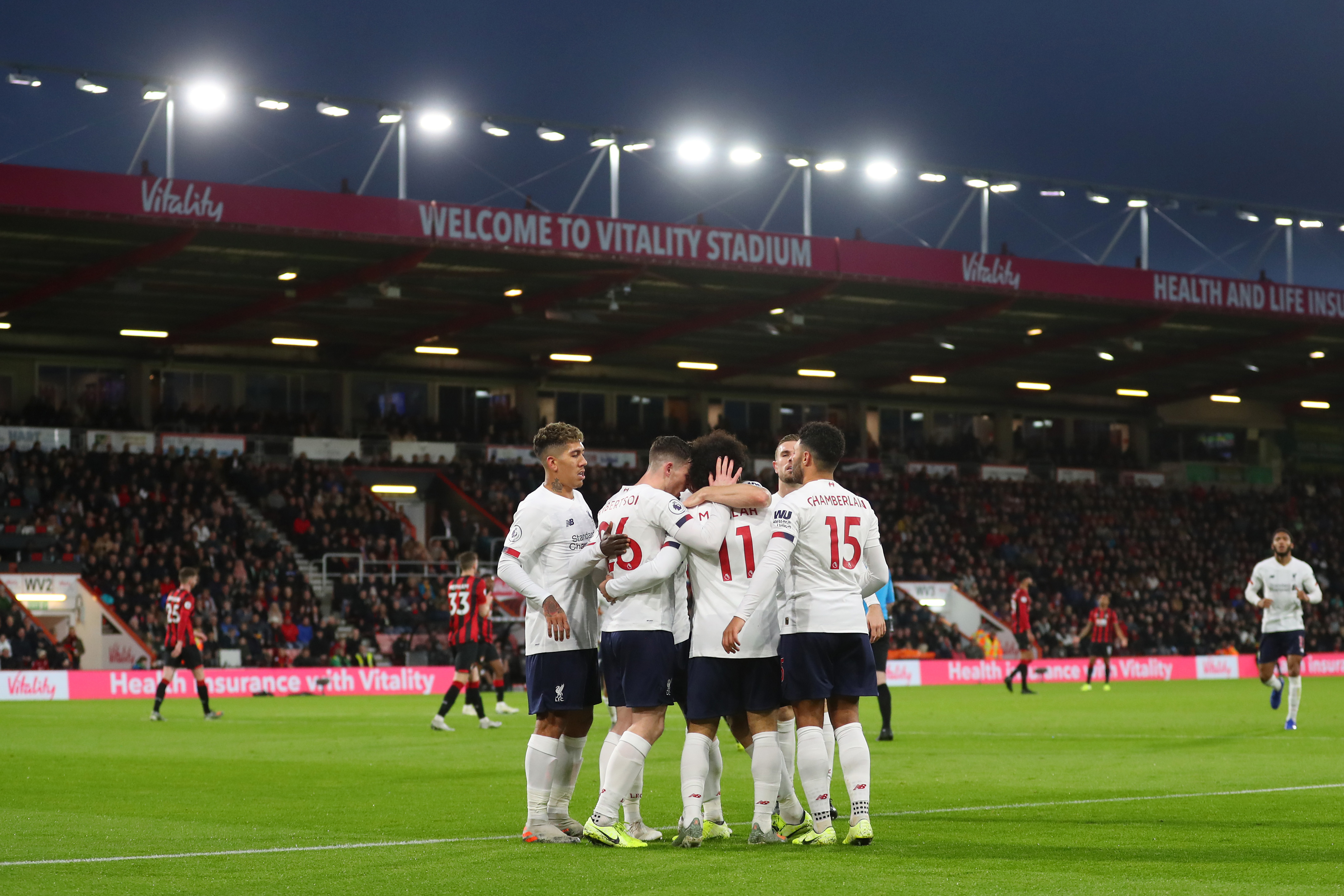 BOURNEMOUTH, ENGLAND - DECEMBER 07: Mohamed Salah of Liverpool celebrates with teammates after scoring his team's third goal during the Premier League match between AFC Bournemouth and Liverpool FC at Vitality Stadium on December 07, 2019 in Bournemouth, United Kingdom. (Photo by Catherine Ivill/Getty Images)