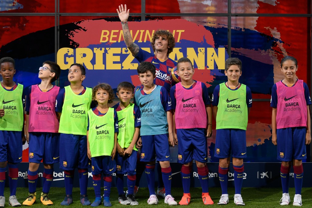 A statement signing. (Photo by Lluis Gene/AFP via Getty Images)