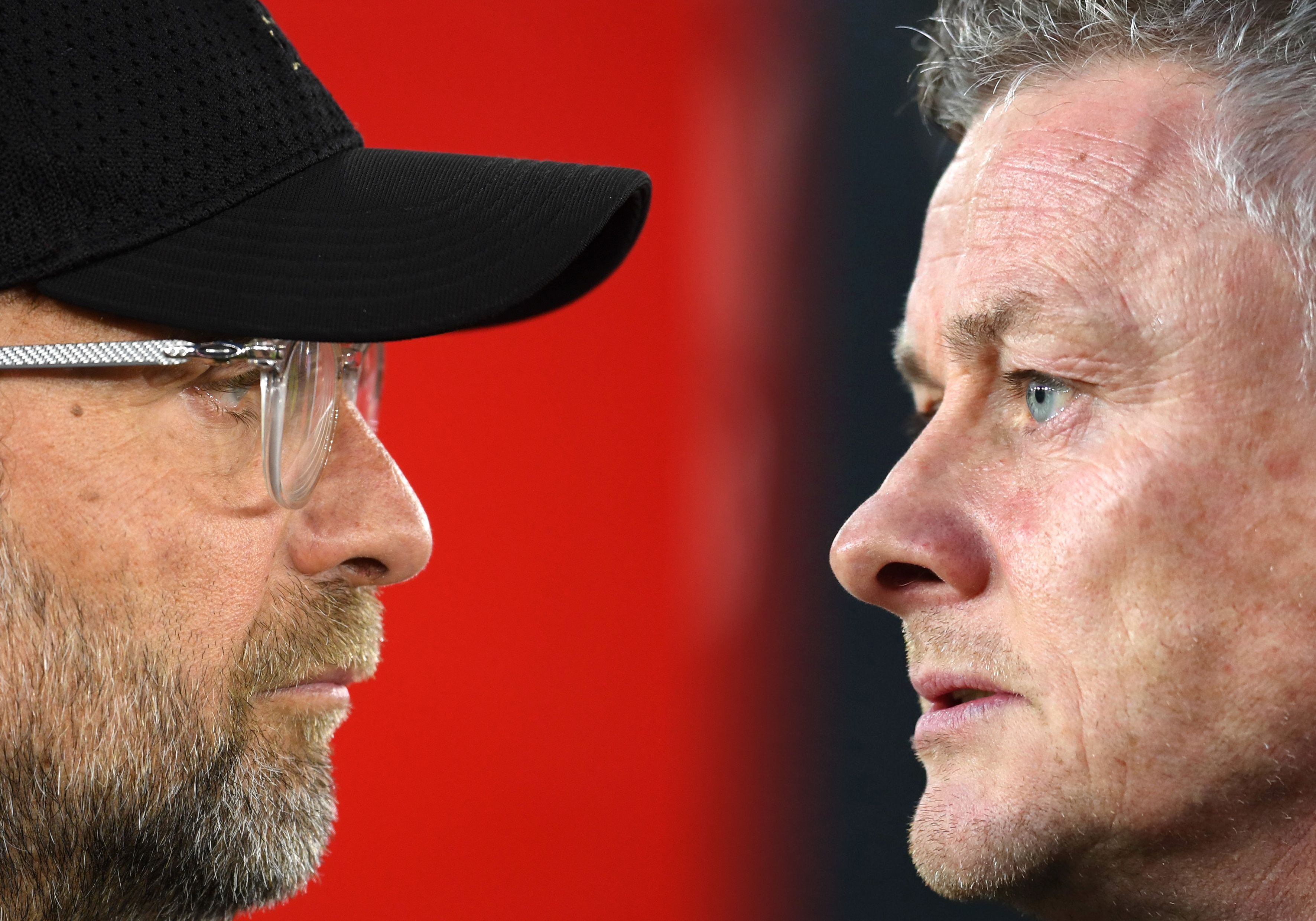 FILE PHOTO (EDITORS NOTE: COMPOSITE OF IMAGES - Image numbers 1140640499,1139964960 - GRADIENT ADDED) In this composite image a comparison has been made between Jurgen Klopp, Manager of Liverpool (L) and Ole Gunnar Solskjaer, Manager of Manchester United. Liverpool and Manchester United meet ina Premier League fixture at Anfield on January 19,2020 in Liverpool. ***LEFT IMAGE*** SOUTHAMPTON, ENGLAND - APRIL 05: Jurgen Klopp, Manager of Liverpool looks on prior to the Premier League match between Southampton FC and Liverpool FC at St Mary's Stadium on April 05, 2019 in Southampton, United Kingdom. (Photo by Mike Hewitt/Getty Images) ***RIGHT IMAGE*** WOLVERHAMPTON, ENGLAND - APRIL 02: Ole Gunnar Solskjaer, Manager of Manchester United looks on prior to the Premier League match between Wolverhampton Wanderers and Manchester United at Molineux on April 02, 2019 in Wolverhampton, United Kingdom. (Photo by Catherine Ivill/Getty Images)