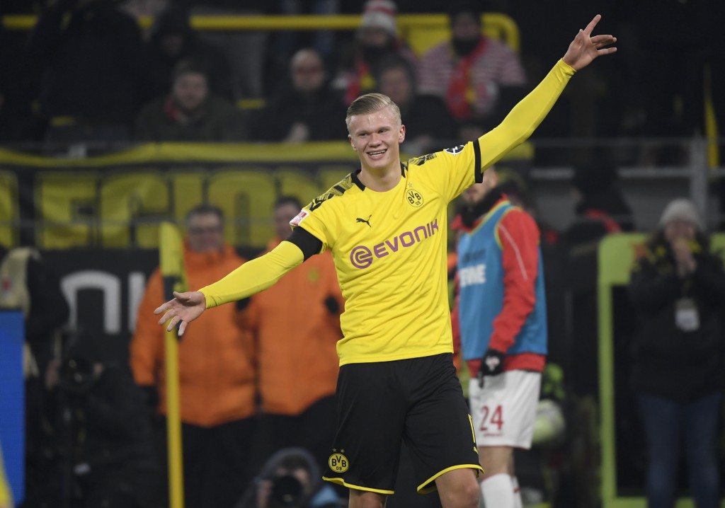 Dortmund's Norwegian forward Erling Braut Haaland celebrate scoring the 4-1 goal during the German first division Bundesliga football match Borussia Dortmund v FC Cologne in Dortmund, on January 24, 2020. (Photo by Ina FASSBENDER / AFP) / DFL REGULATIONS PROHIBIT ANY USE OF PHOTOGRAPHS AS IMAGE SEQUENCES AND/OR QUASI-VIDEO (Photo by INA FASSBENDER/AFP via Getty Images)