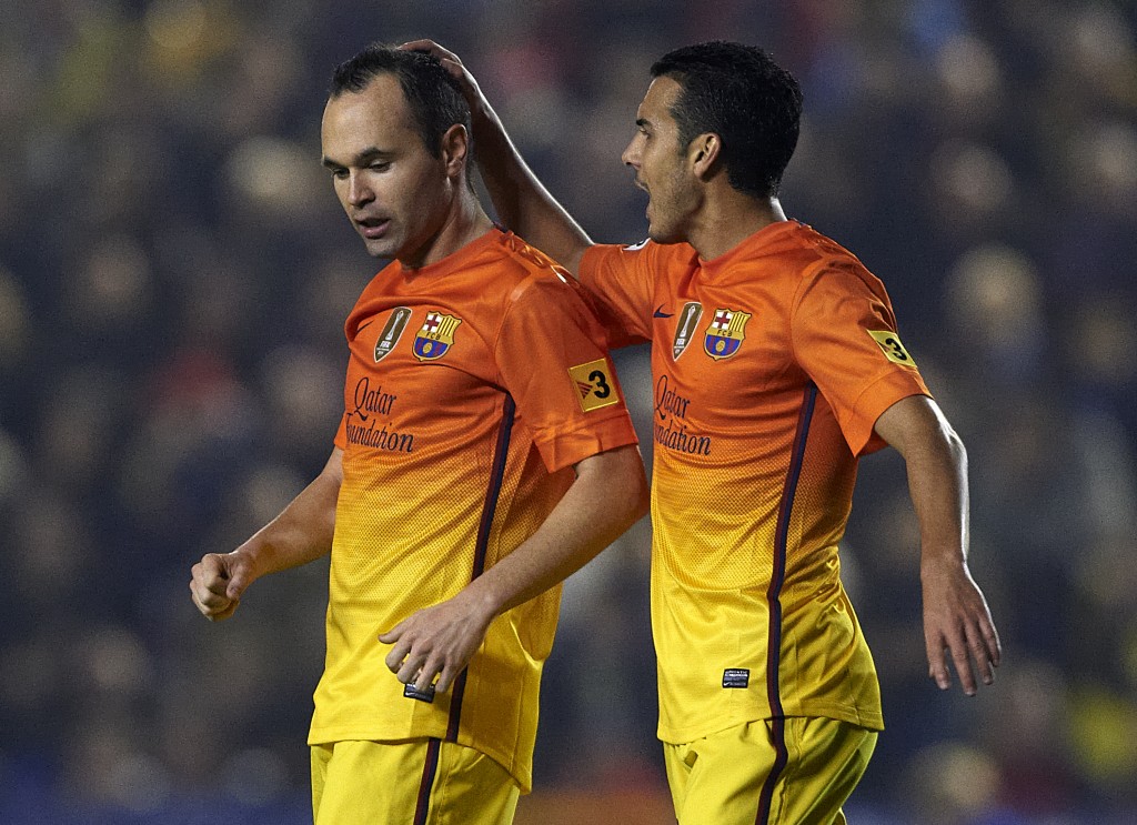 VALENCIA, SPAIN - NOVEMBER 25: Andres Iniesta (L) of Barcelona celebrates scoring with his teammate Pedro Rodriguez during the la Liga match between Levante UD and FC Barcelona at Ciutat de Valencia on November 25, 2012 in Valencia, Spain. (Photo by Manuel Queimadelos Alonso/Getty Images)