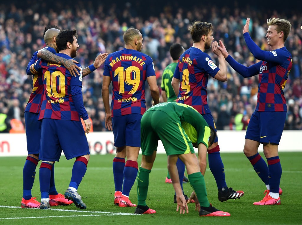 BARCELONA, SPAIN - FEBRUARY 22: Lionel Messi of FC Barcelona celebrates with teammates Martin Braithwaite, Arturo Vidal and Ivan Rakitic after scoring his team's fourth goal during the La Liga match between FC Barcelona and SD Eibar SAD at Camp Nou on February 22, 2020 in Barcelona, Spain. (Photo by Alex Caparros/Getty Images)