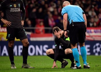 Liverpool captain Jordan Henderson is ruled out for the rest of the season due to a knee injury. (Photo by Javier Soriano/AFP via Getty Images)